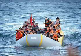 Refugees travel in a rubber boat across the Aegean Sea from Turkey to the Greek island of Lesbos on November 2, 2015.  Photo by Paul Jeffrey