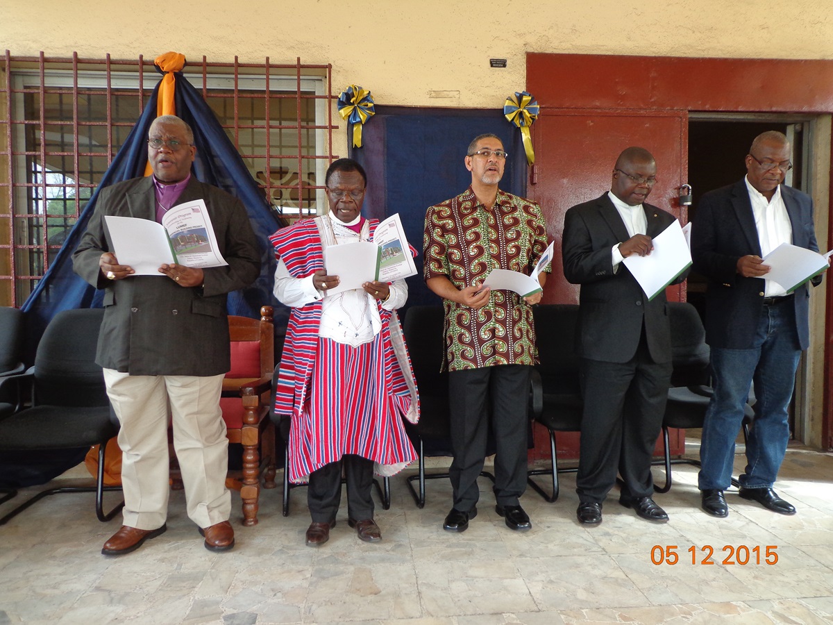 Bishops Jonathan Hart and John Innis stand with platform guests including Moni Captan, LUMEF Board Chairman. (3rd from left) 