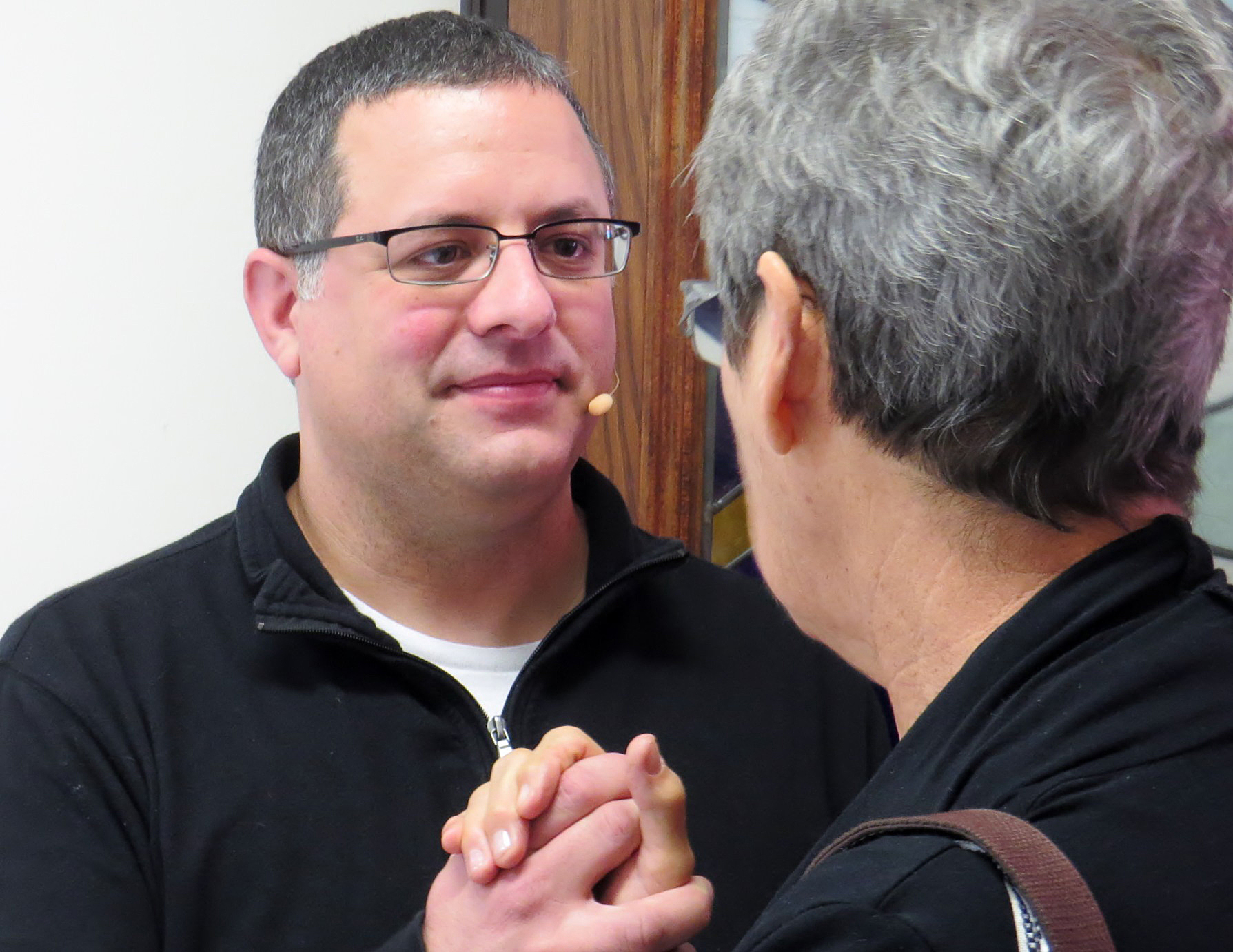 The Rev. Omar Rikabi, pastor of First United Methodist Church in Heath, Texas, greets a parishioner after worship on Jan. 17. UMNS photo by Sam Hodges