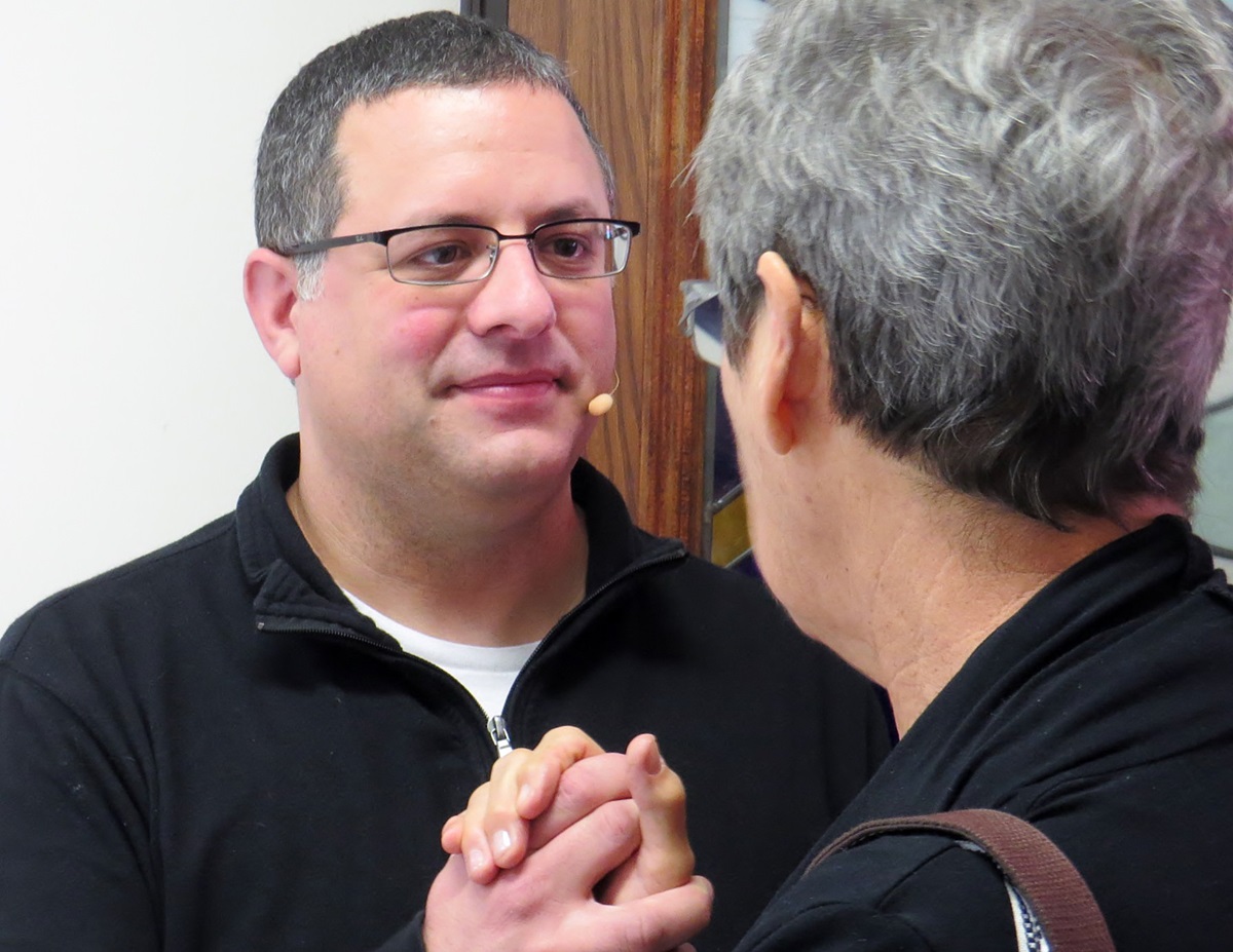 The Rev. Omar Rikabi, pastor of First United Methodist Church in Heath, Texas, greets a parishioner after worship on Jan. 17. UMNS photo by Sam Hodges