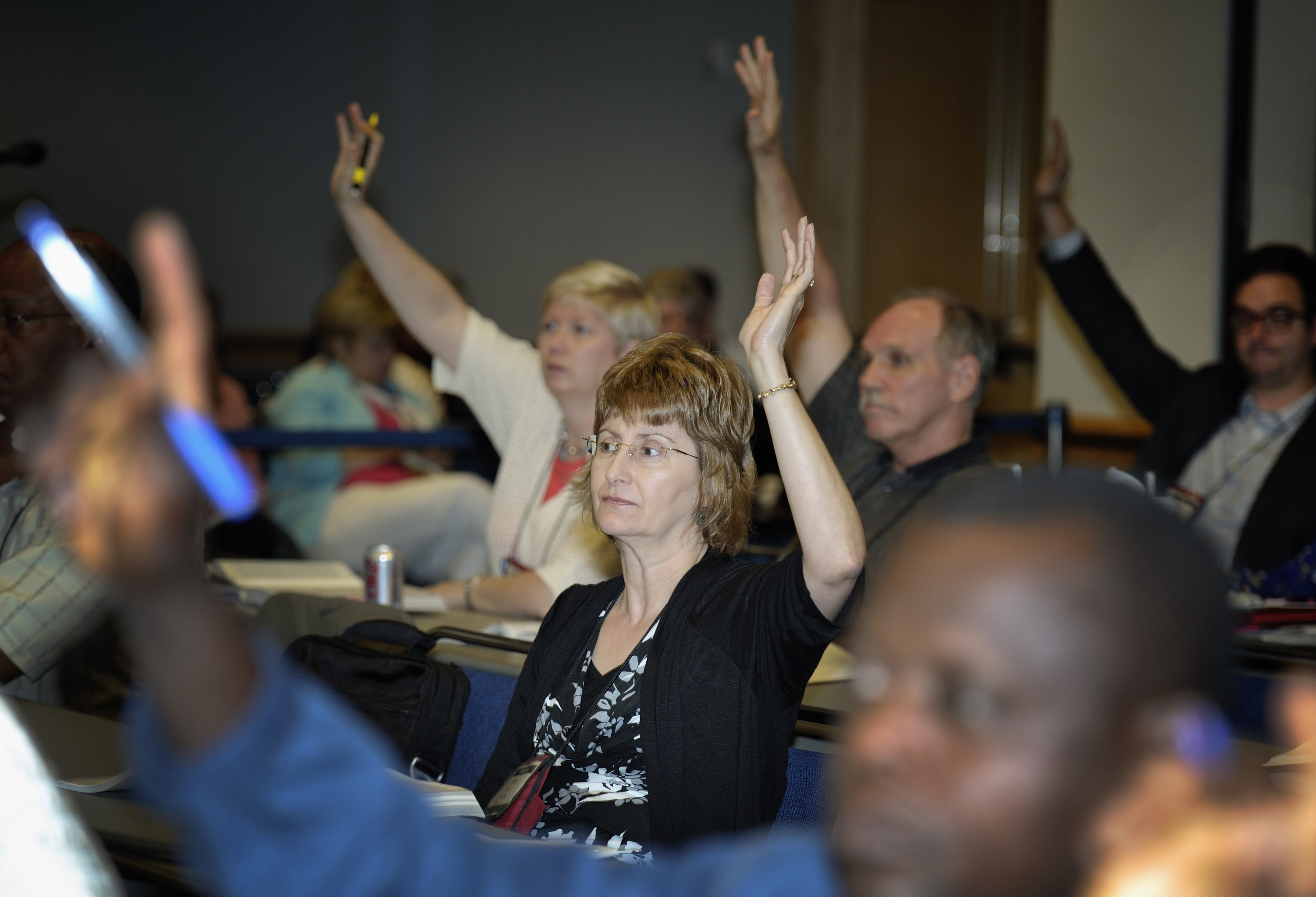 Committee members vote on proposed legislation during the 2012 United Methodist General Conference in Tampa, Florida. In 2016, delegates will be able to use machines to vote in legislative committees. Photo by Paul Jeffrey, UMNS