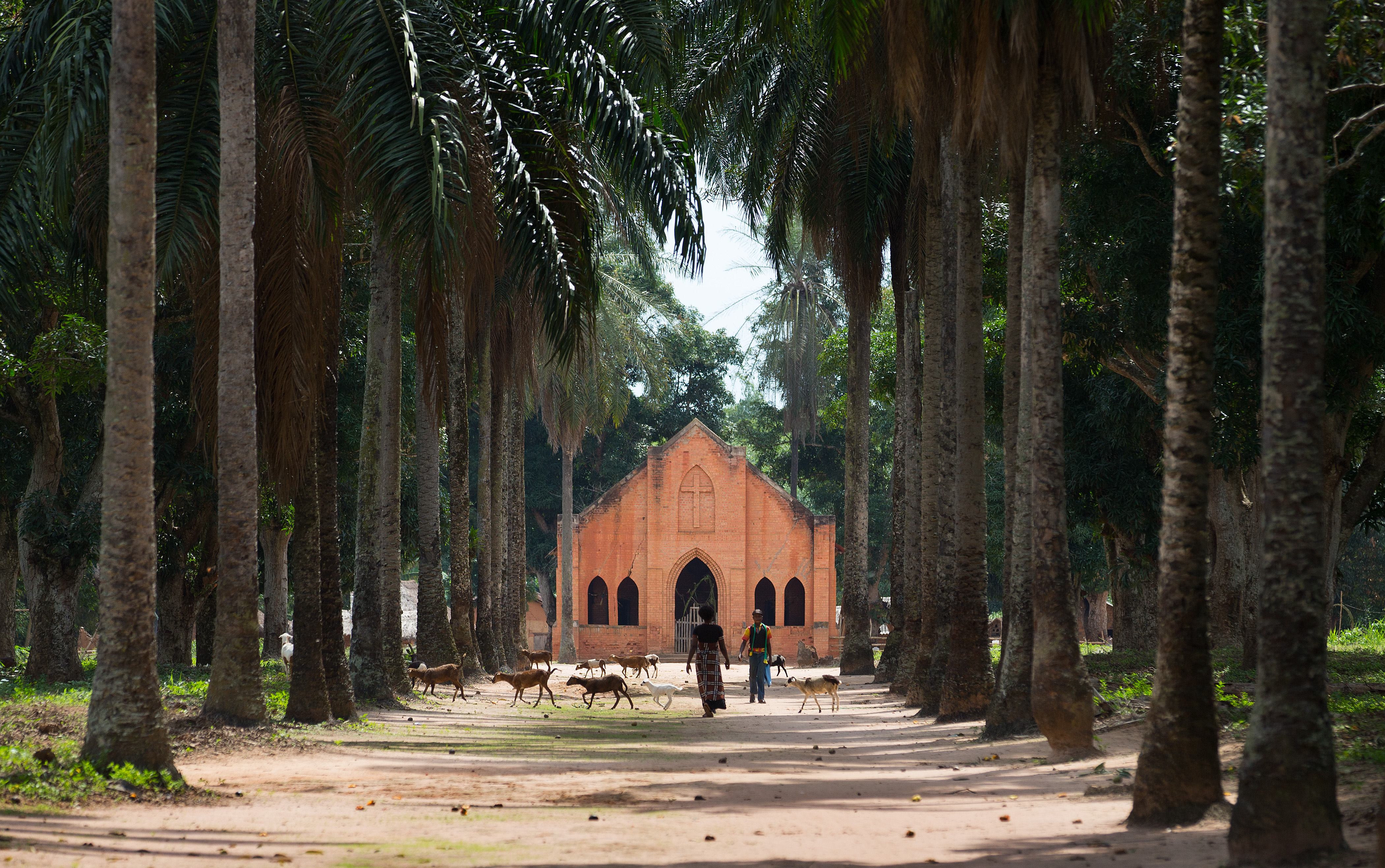 The United Methodist Church at the Tunda Mission Station stands at the end of a tree-lined street in Tunda, Democratic Republic of Congo.