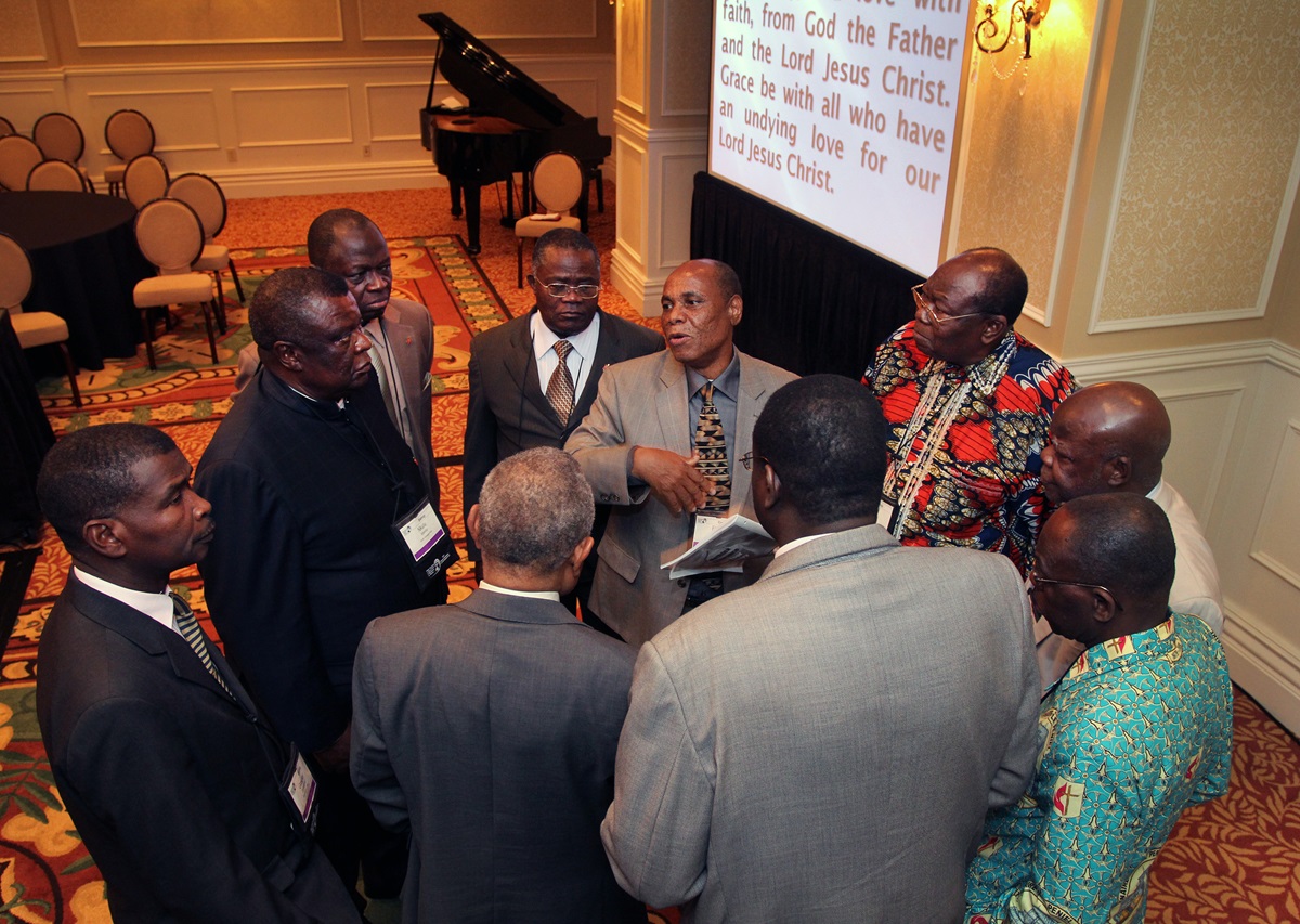 Bishop Eben Nhiwatwa of Zimbabwe (center) holds a meeting of African bishops following the April 26, 2012 "passing of the gavel ceremony.” 