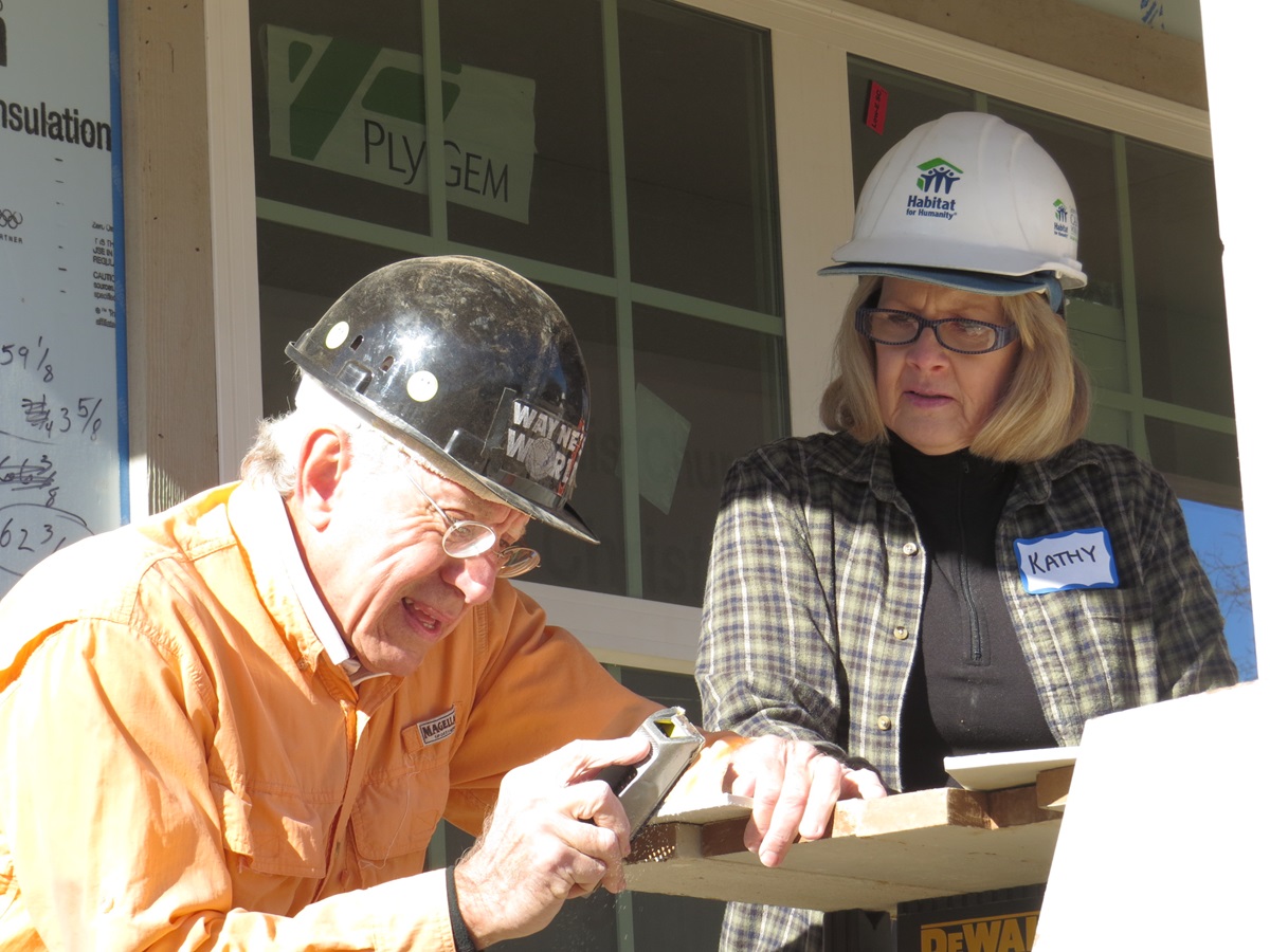 Wayne Chaffin has volunteered on 100 Habitat for Humanity houses built by Highland Park United Methodist Church’s Carpenters for Christ group during the last 20 years. On Jan. 27, he and Kathy Adams worked together as the 100th house neared completion in time for the Dallas church’s centennial celebration. Photo by Sam Hodges, UMNS