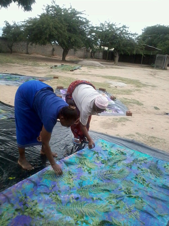 Tree branches and leaves are used as stencils to print nature designs on fabric. Photo by Eveline Chikwanah, UMNS