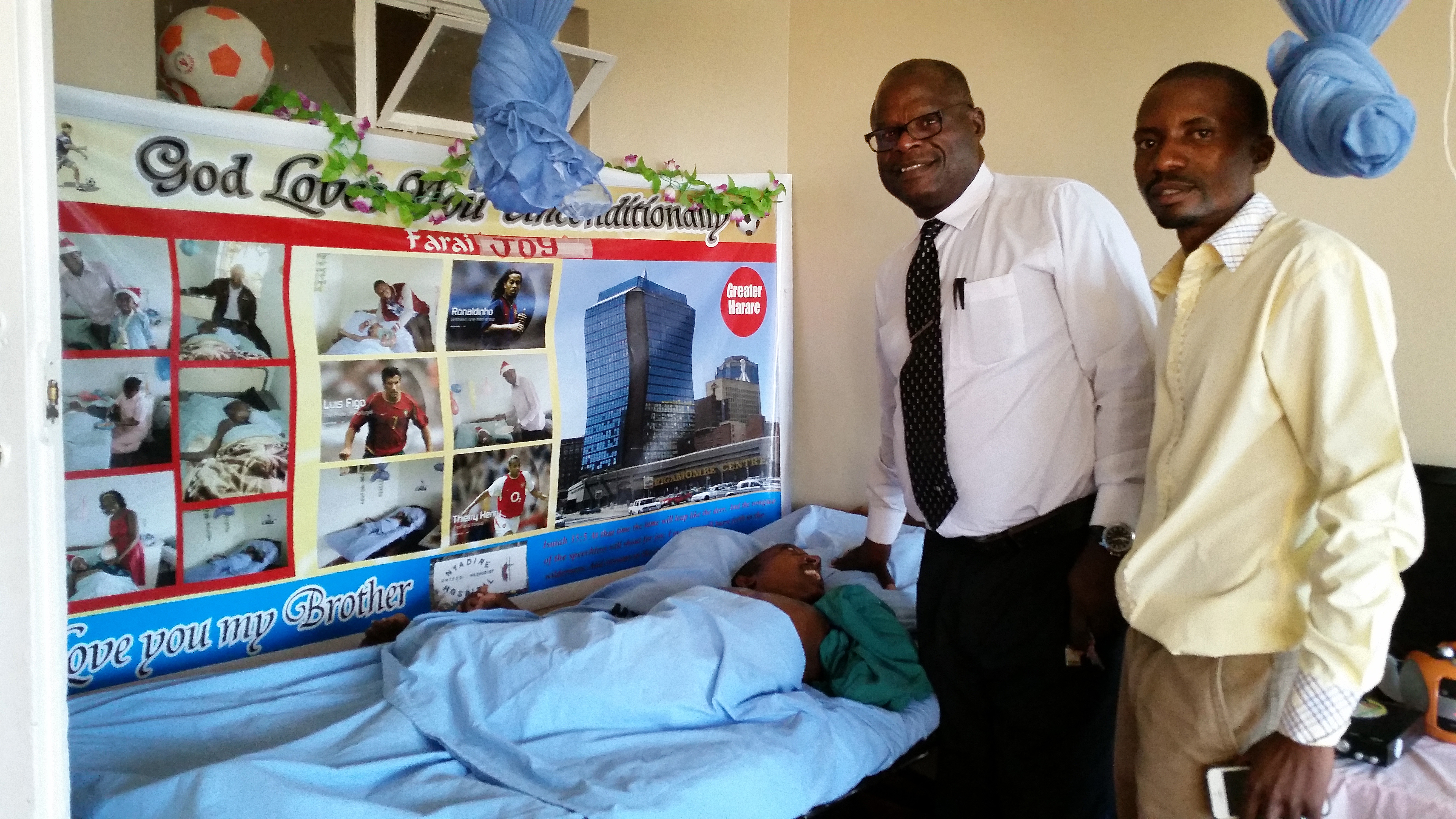 The Rev. Lancelot Mukundu and Learnmore Kateguru visit by the hospital bed of Farai “Joy” Kanyemba at the United Methodist Nyadire Mission Hospital in Zimbabwe. Photo by Eveline Chikwanah, UMNS