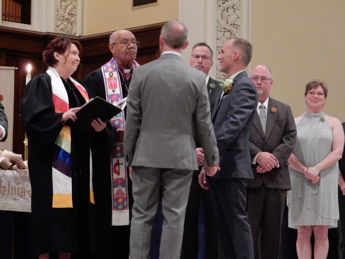 The Rev. Val Rosenquist, at left, and retired Bishop Melvin Talbert co-officiate at the wedding of Jim Wilborne and John Romano, both 52, at First United Methodist Church in Charlotte, N.C. Photo courtesy of Reconciling Ministries Network