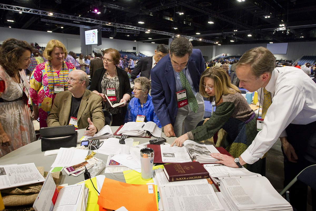 Members of the Virginia delegation discuss possible next steps after the United Methodist Judicial Council ruled the proposed "Plan UMC" for church restructuring to be unconstitutional during the 2012 General Conference in Tampa, Fla. The council will consider a request for a declaratory decision on “Plan UMC Revised” when it meets in Portland, Ore., in advance of the 2016 General Conference. File photo by Mike DuBose, UMNS