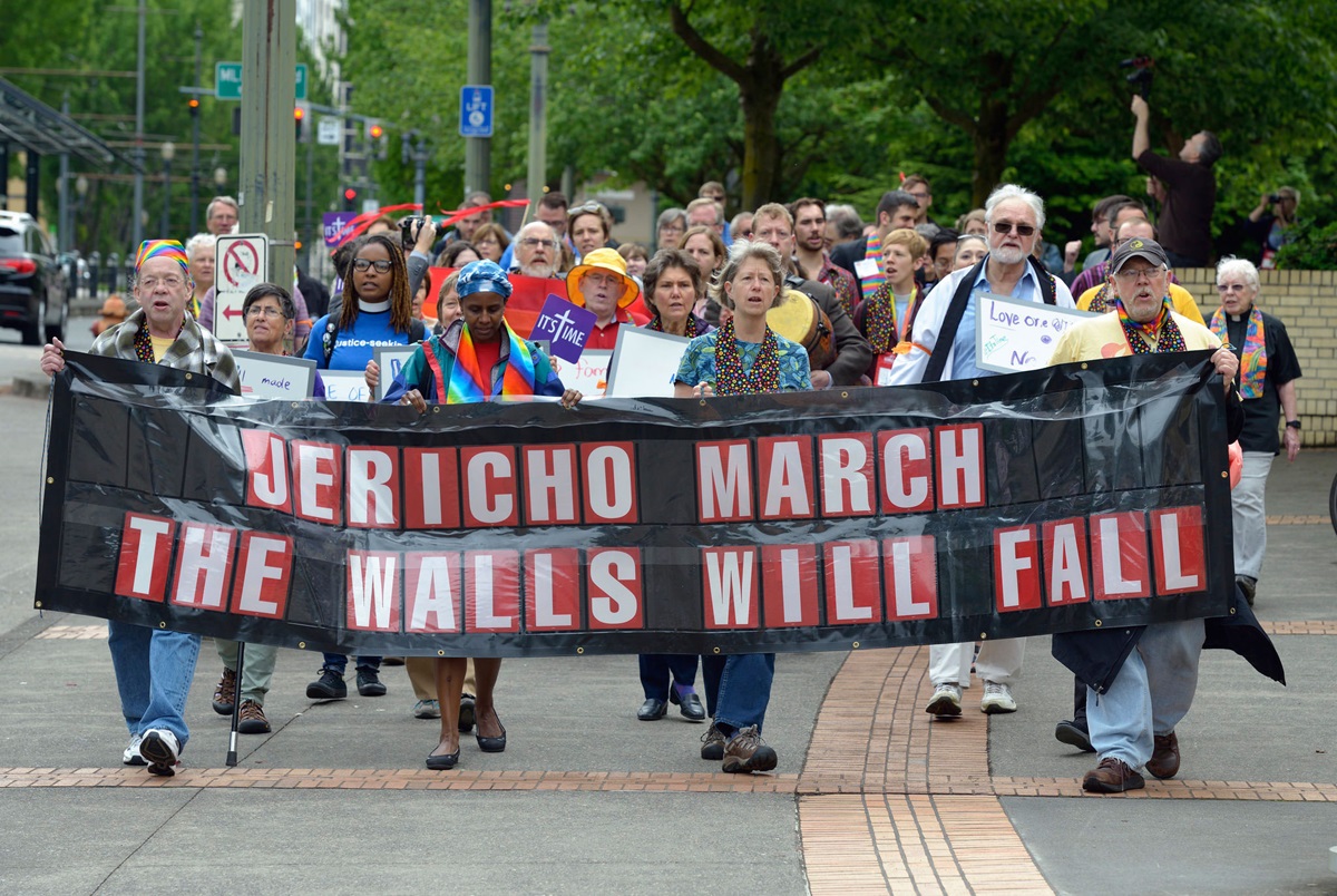Rights activists march on May 16 around the Oregon Convention Center, the site of the 2016 United Methodist General Conference in Portland, Ore. Using the theme of Jericho in which walls were brought down, the demonstrators were demanding that the church be more inclusive of LGBTQ people in its ministries. Photo by Paul Jeffrey, UMNS.