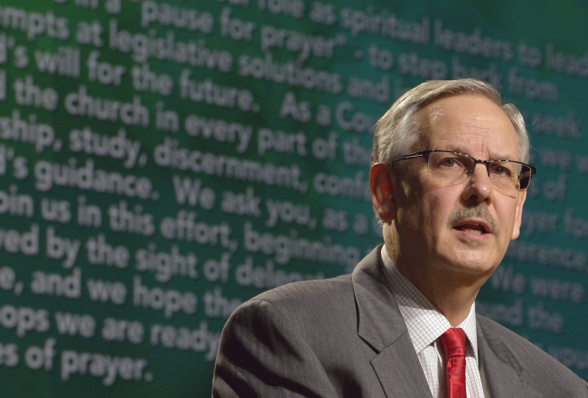 Bishop Bruce R. Ough reads a statement about sexuality and the church from the denomination's Council of Bishops on May 18 at the 2016 United Methodist General Conference in Portland, Ore. Photo by Paul Jeffrey, UMNS.