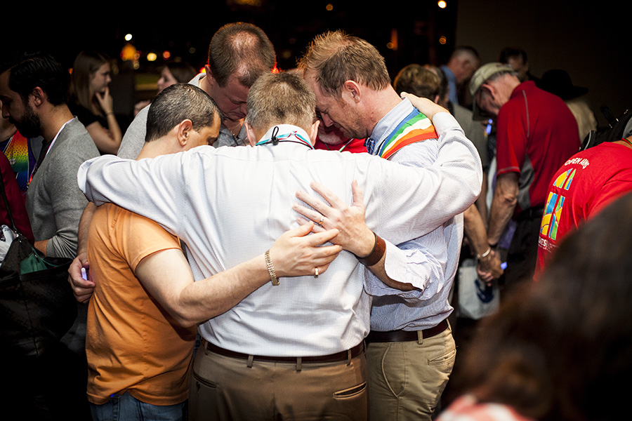 Members of the Florida Conference of The United Methodist Church comfort one another during a prayer vigil in response to the mass shooting at Pulse, a gay nightclub in Orlando. The vigil was held in Orlando on the first day of the conference’s yearly meeting. Photo by Lance Rothwell, Florida Conference