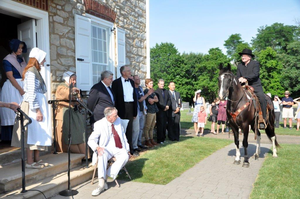 A colonial-era circuit-riding evangelist was part a special service on June 26 at Boehm’s Chapel, a United Methodist heritage landmark near Lancaster, Pennsylvania. A trio of Mennonite bishops brought a proclamation reversing the 1775 ex-communication of Martin Boehm, a Mennonite who became a founder of the present-day United Methodist Church. Photo by John Coleman, Eastern Pennsylvania Conference