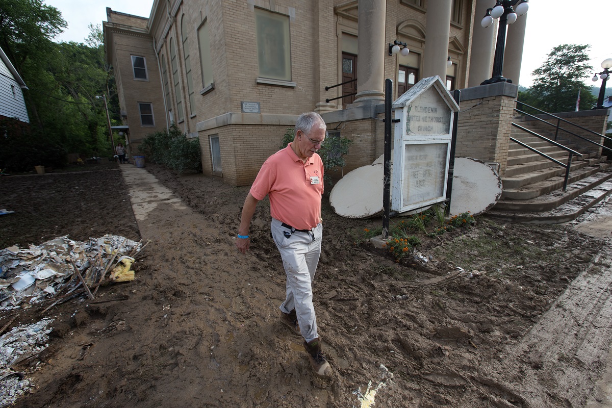 The Rev. J.F. Lacaria surveys flood damage at Clendenin (W. Va.) United Methodist Church. Photo by Mike DuBose, United Methodist Communications.