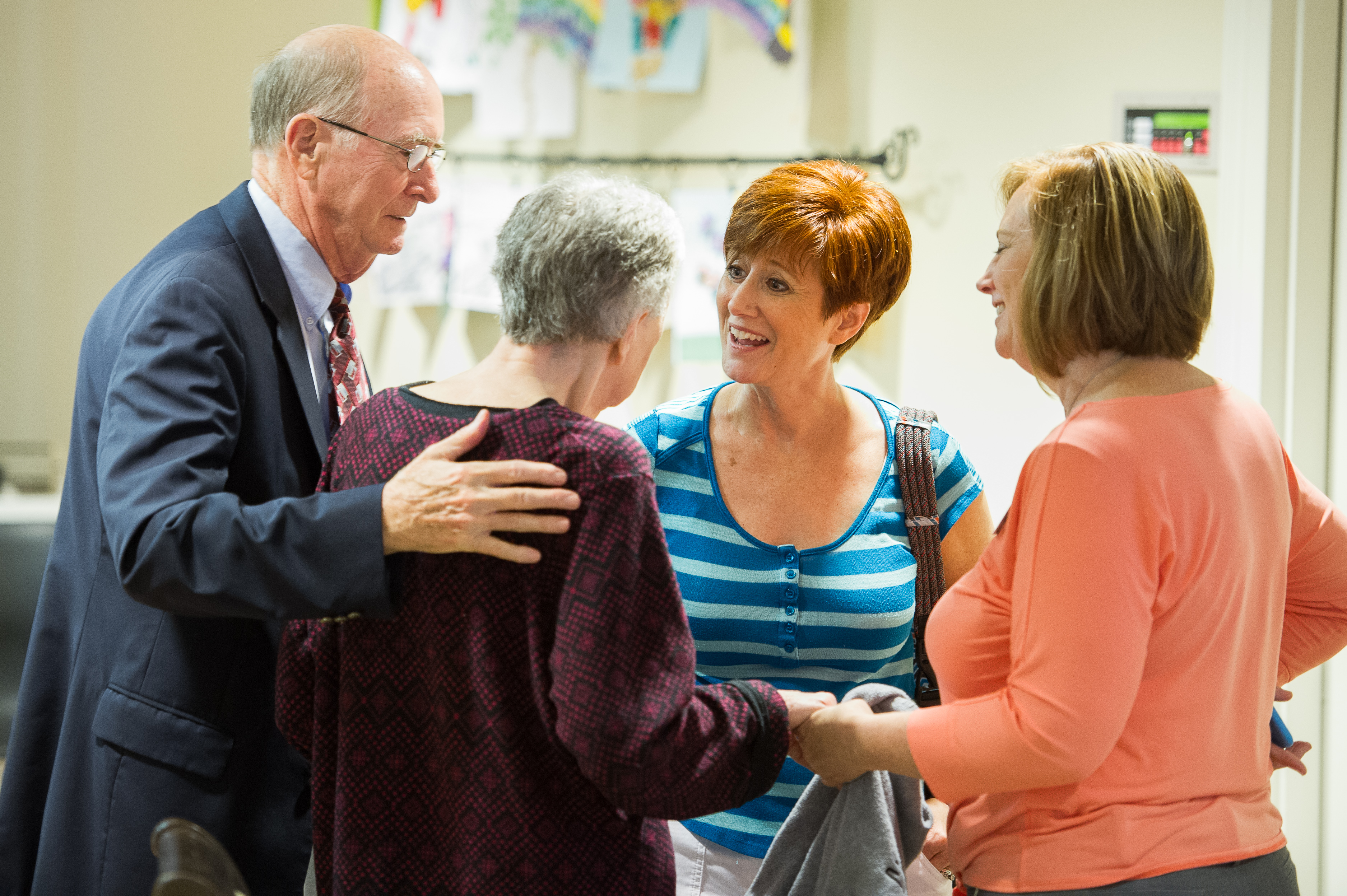 The Carder family gathers at the Bethany memory unit at the Heritage at Lowman senior community near Columbia, S.C. Retired United Methodist Bishop Kenneth Carder  stands with wife, Linda, and their daughters Sheri Carder Hood (second from right) and Sandra Carder Nash (far right). Photo by Matt Brodie.
