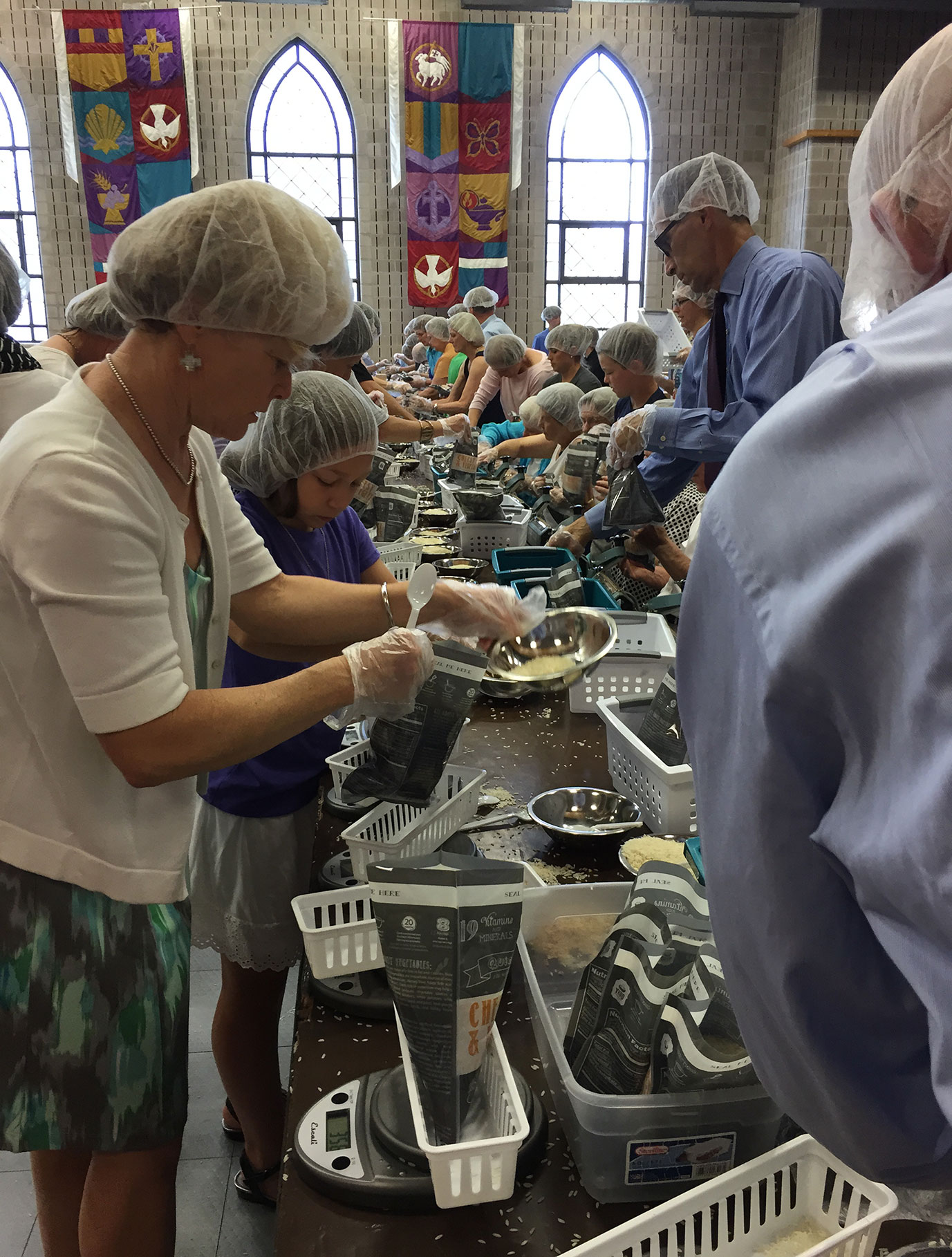 Members of Pulaski Heights United Methodist Church in Little Rock, Ark., pack meals for hungry families in the state. The church is among the congregations growing in worship attendance. Photo courtesy of Andrea Wymes