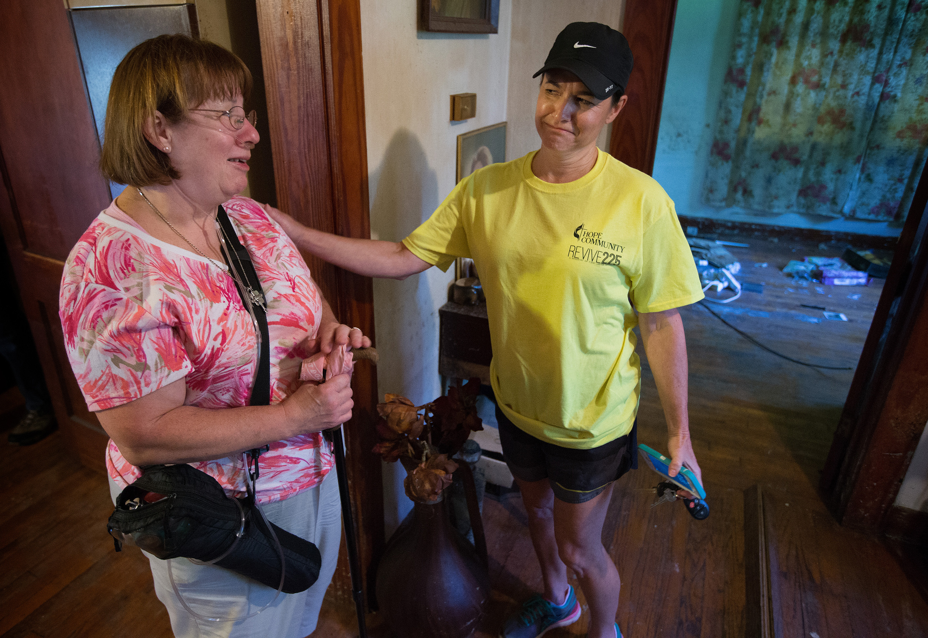 Janet Schilling (left) visits with volunteer Joni Rigby at a rental home that her family owns in Baton Rouge, La. The home was heavily damaged by flooding in the neighborhood where Schilling grew up. Rigby was part of a volunteer team from First United Methodist Church in Baton Rouge. Photo by Mike DuBose, UMNS