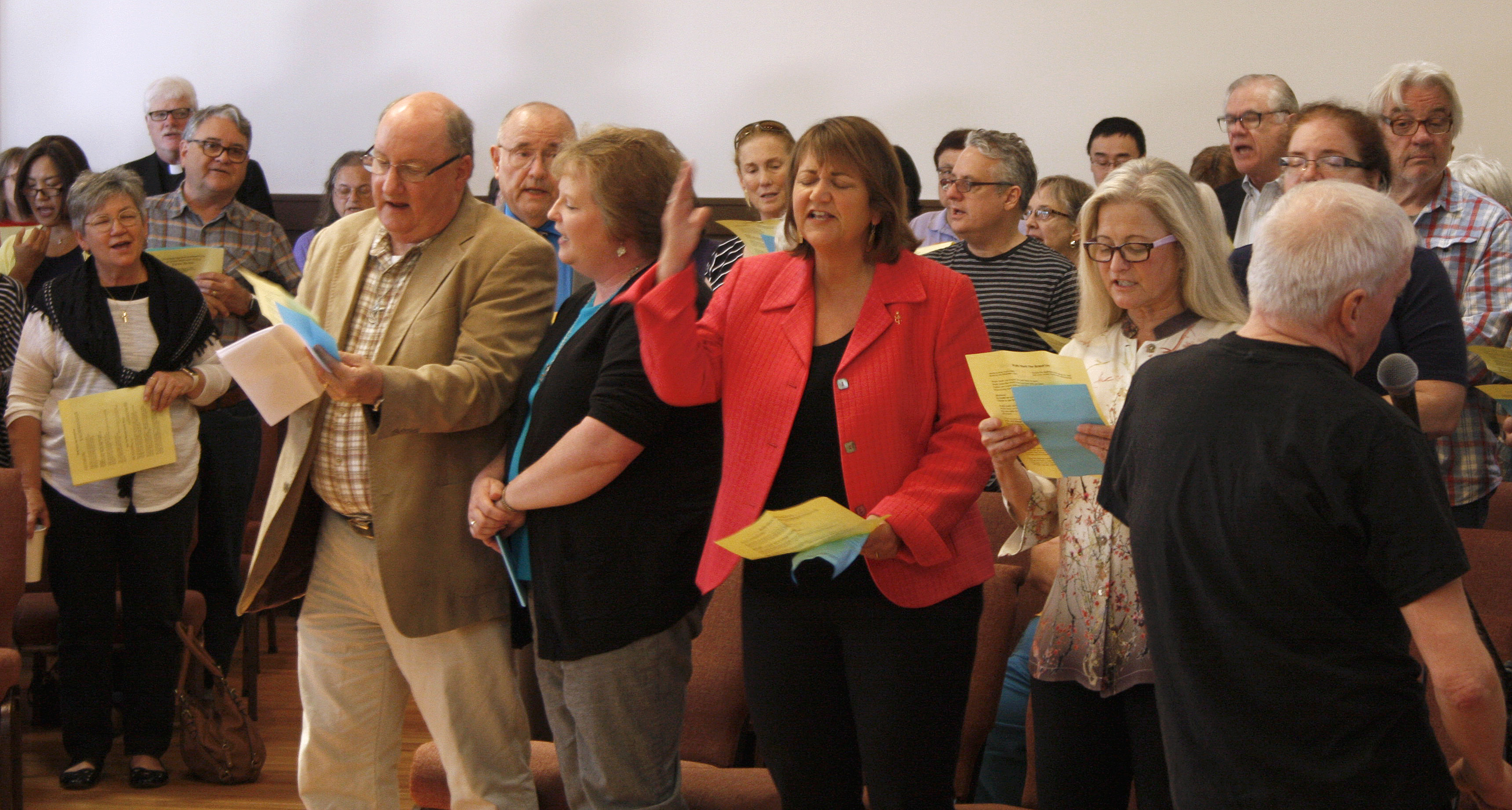 Bethany United Methodist Church held a reception for Bishop Karen Oliveto (center, red jacket) and her wife, Robin Ridenour, during their last weekend in San Francisco, Aug. 13-14. Oliveto was first a member of the congregation, then pastor from 1992-2004. Photo by Kathy L. Gilbert, UMNS