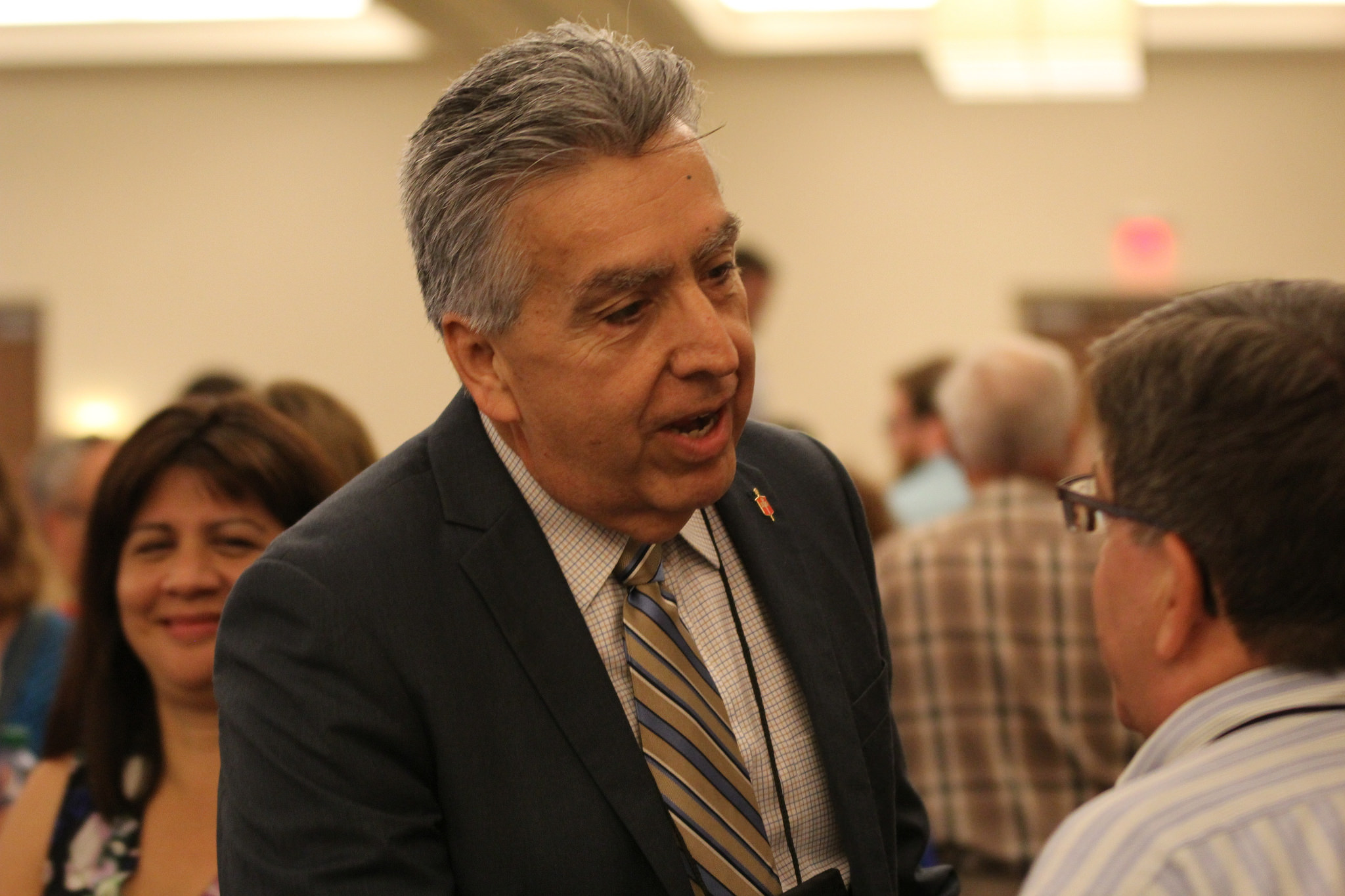 Bishop Ruben Saenz Jr. mingles with Great Plains Conference delegates and others at the South Central Jurisdictional Conference in Wichita, Kan., where he was elected to the episcopacy on July 14. Saenz was assigned to lead Great Plains. Photo by Eugenio Hernandez.
