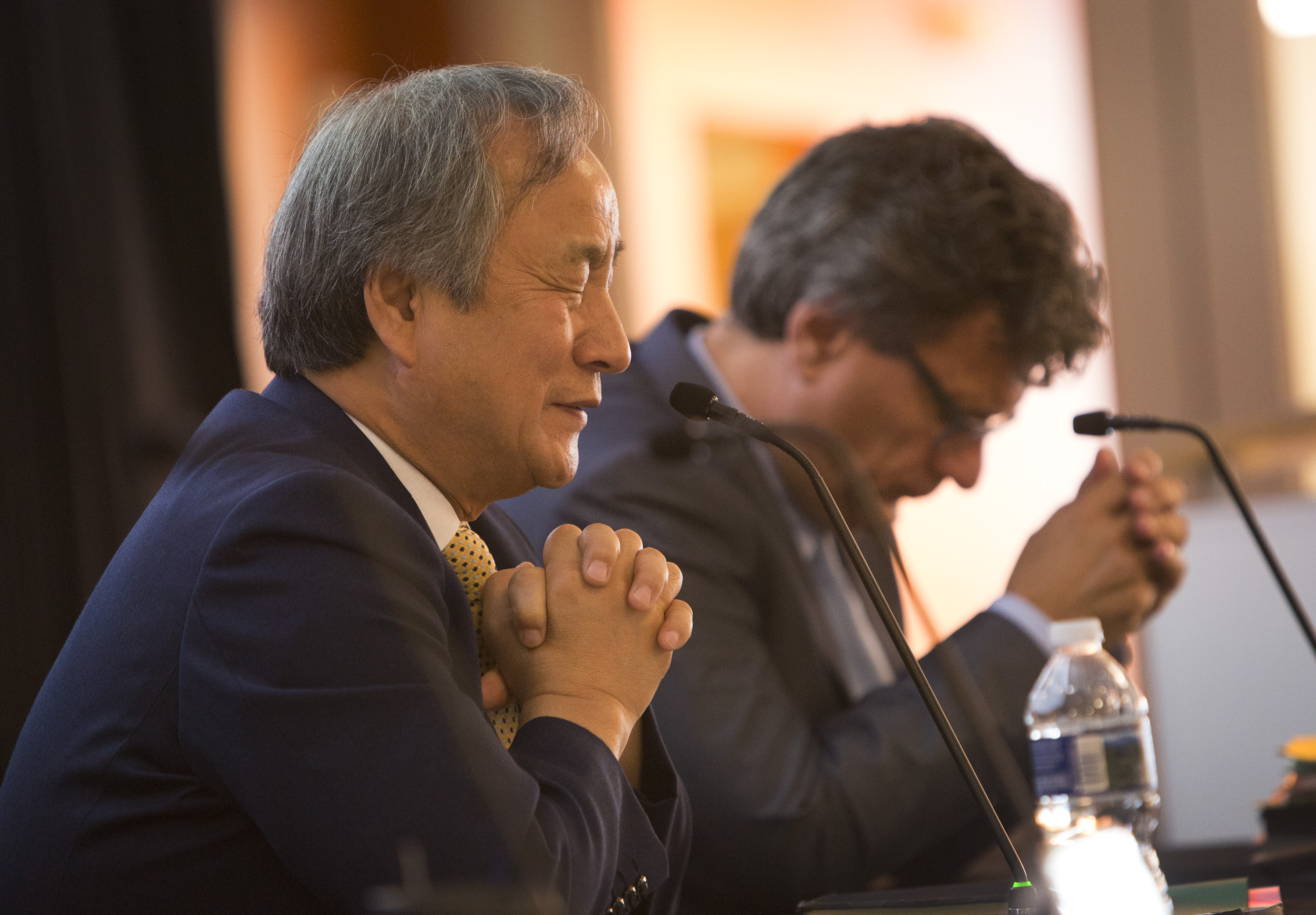 Bishop Hee-Soo Jung and Thomas Kemper pray during the morning session of the annual board meeting of the General Board of Global Ministries held at the new United Methodist Church Global Mission Center in Atlanta on Oct. 20, 2016. Photo by Kathleen Barry, United Methodist Communications