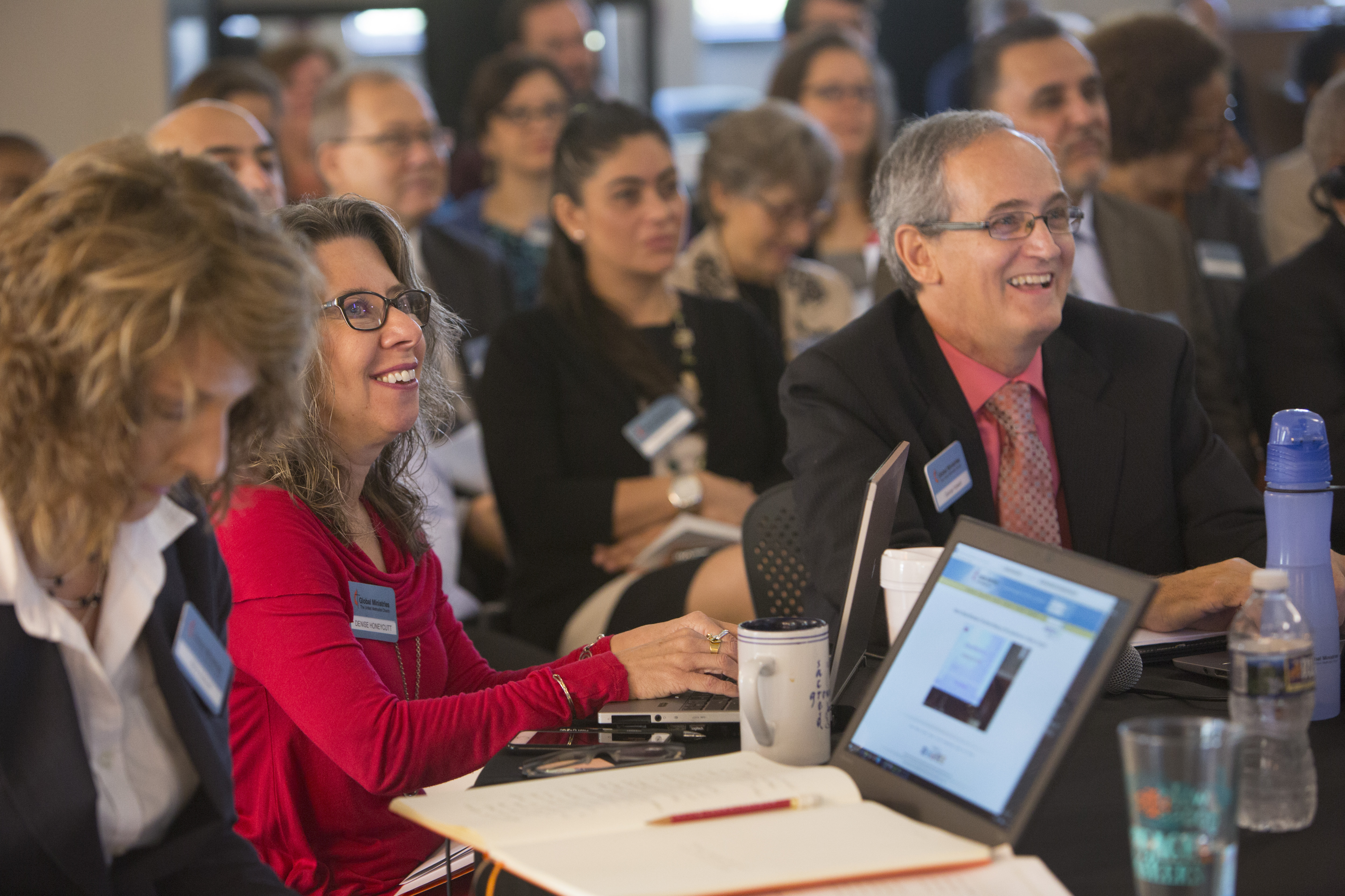 (From left) Cabinet members, Mary Abdreolli, Denise Honeycutt, and George Howard listen to Thomas Kemper during the meeting of directors, cabinet and staff in Atlanta. 