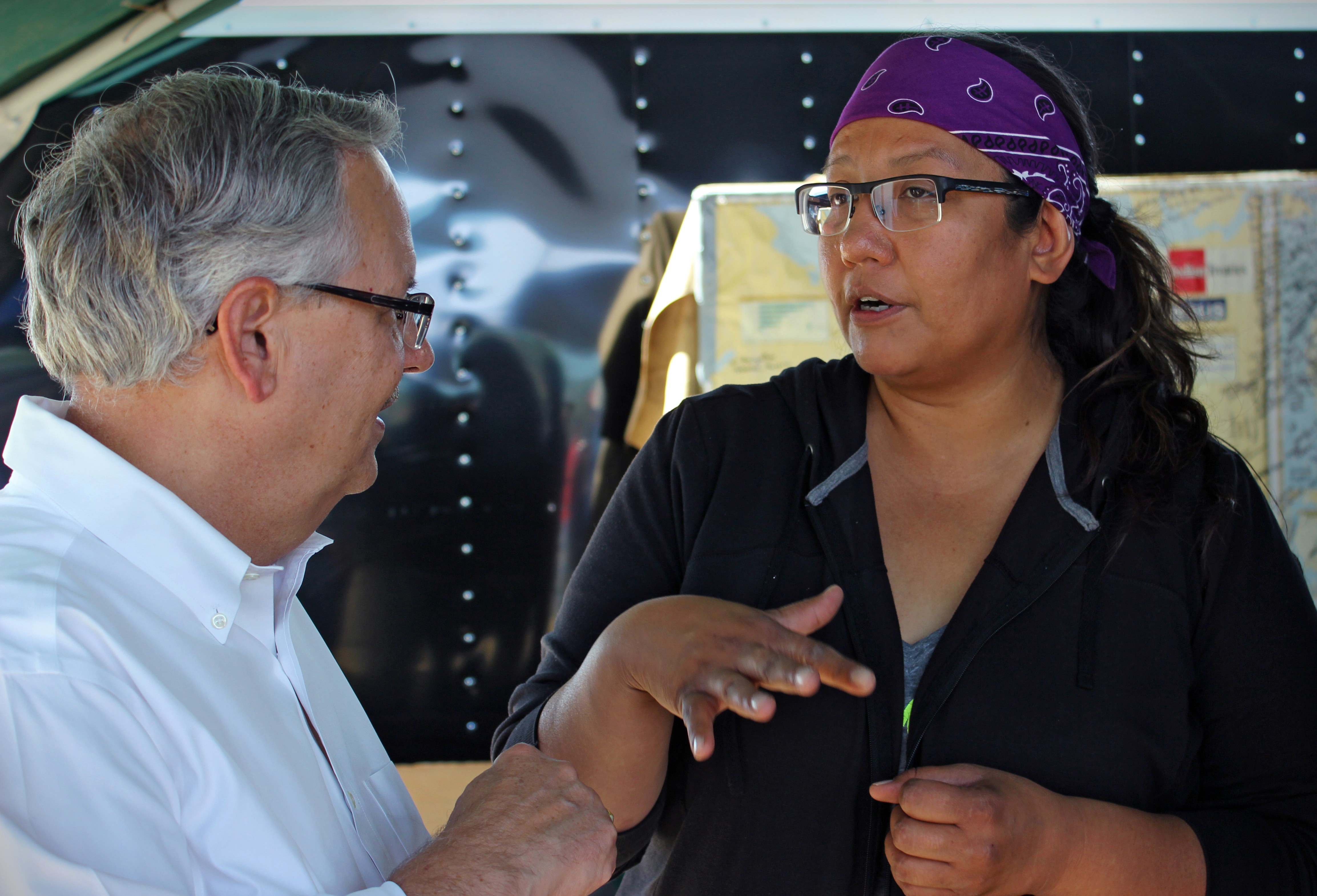 Bishop Bruce Ough and Jennifer Martell of Sitting Bull College met at a camp near Cannon Ball, N.D., on Sept. 10. The camp has been a gathering place for opposition by the Standing Rock Sioux and many others to the Dakota Access Pipeline. Photo by Dave Stucke, Dakotas Conference.