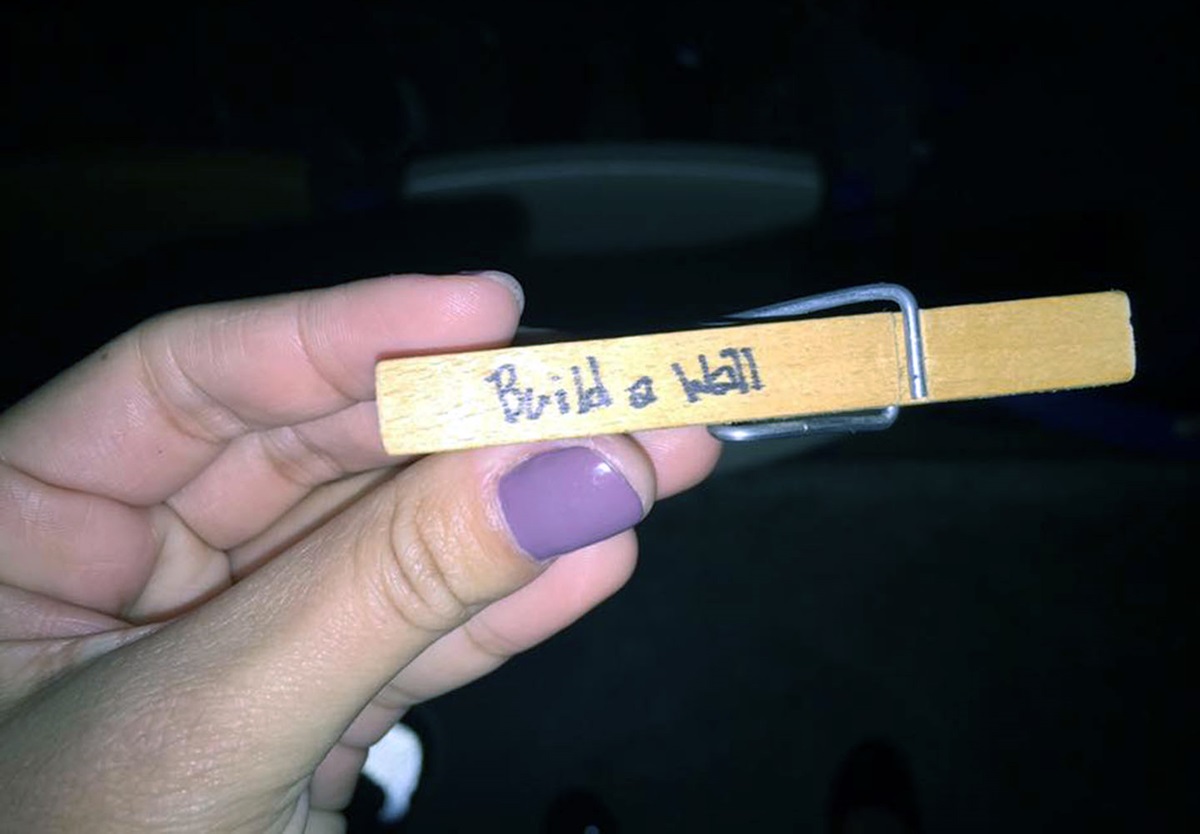 One Hispanic/Latino youth attending Pilgrimage 2016, a youth event in the North Carolina Conference, had a clothespin placed on him by an unknown person, with the words “I Love Trump” on one side and “Build a Wall” on the other. Photo courtesy of Stacy Guinto-Salinas.
