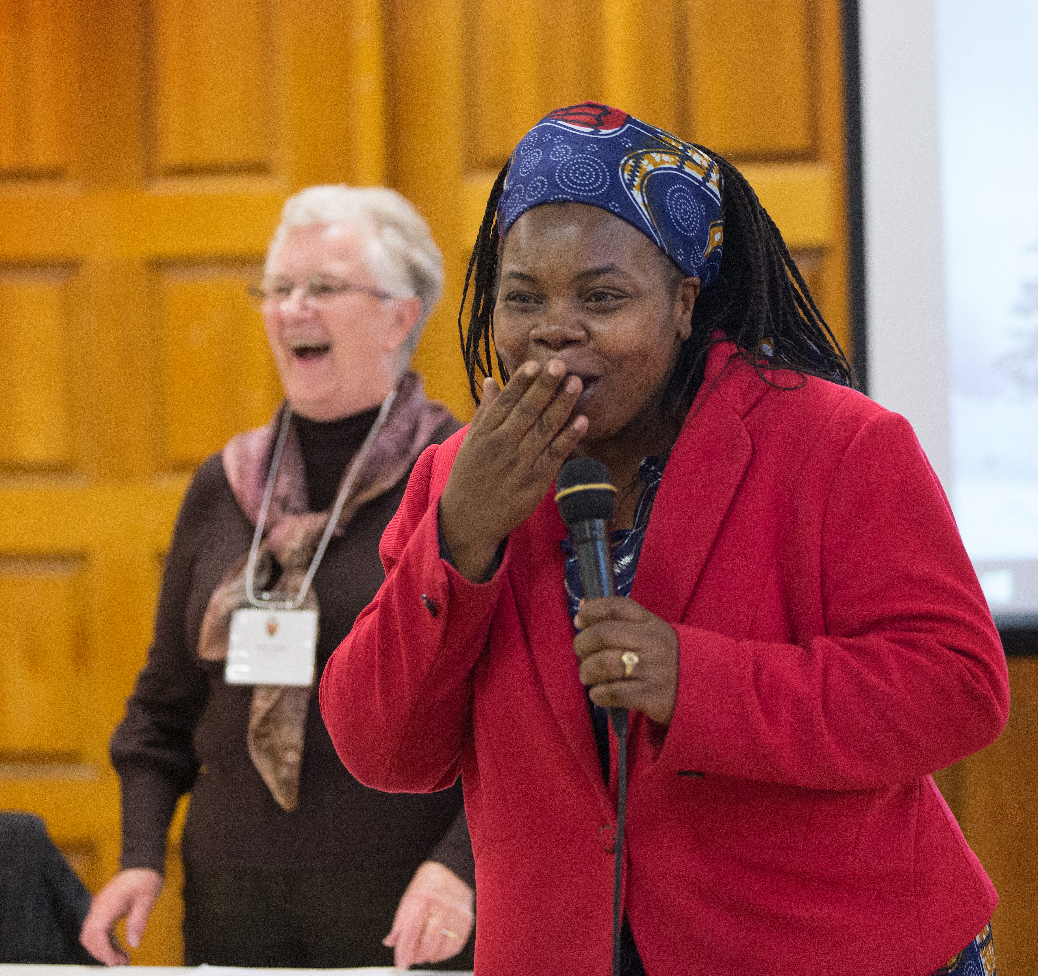 The Rev. Tazvionepi Nyarota (right) ululates to express her appreciation of a decision by  the Edmonton Presbytery, a governing body in the United Church of Canada, to support the Zimbabwe United Methodist Church in Canada as a mission of the United Church. The meeting was held at McDougall United Church in Edmonton, Alberta. Photo by Mike DuBose, UMNS.