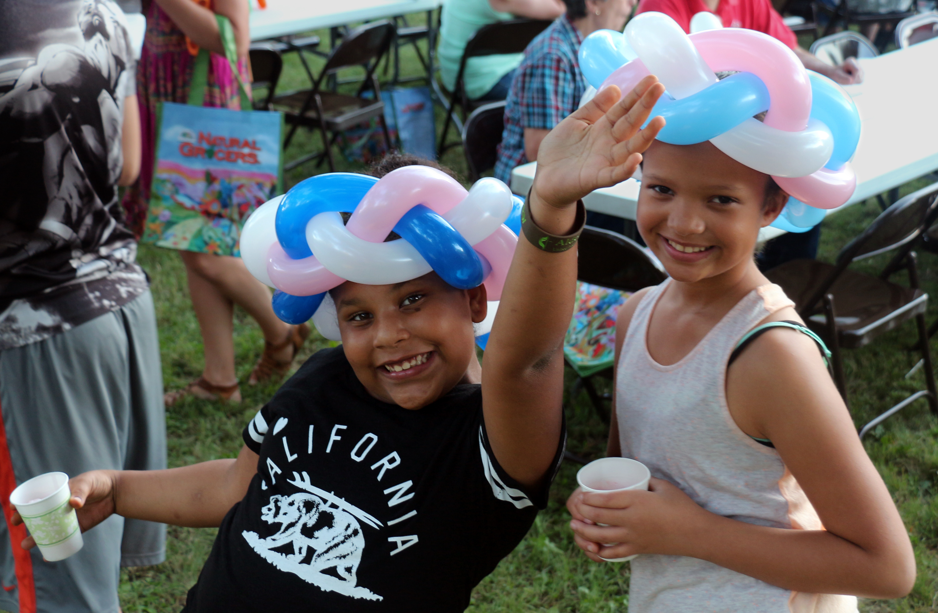 Children at Aldersgate United Methodist Church enjoy their balloon animal hats. Photo by David Burke
