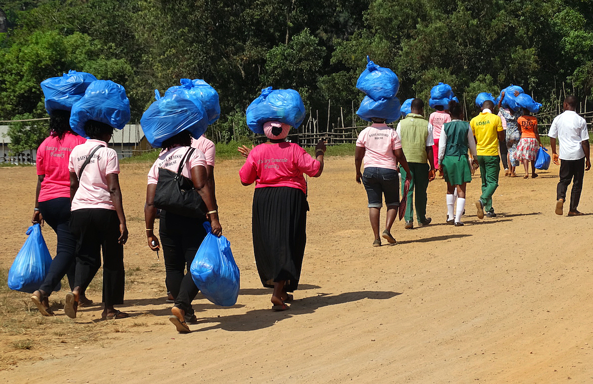 During the United Methodist Women’s convention in Kabala, northern Sierra Leone, women break up into groups and go into the rural communities to live and work with the community. In addition to their prayer ministry, they also take gifts of clothing, shoes or toiletries. 