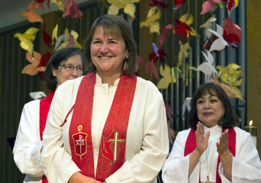Newly elected Bishop Karen Oliveto, a married lesbian who has become the first openly gay bishop of The United Methodist Church, stands with Big Sky Area Bishop Elaine Stanovsky, left, and Los Angeles Area Bishop Minerva Carcaño. Photo by Charmaine Robledo, Mountain Sky Episcopal Area. 