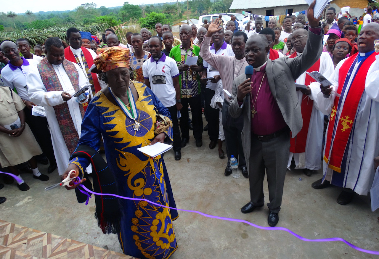 Paramount Chief Madam Matilda Yayo Yilla cuts the ribbon at the official opening of Wesley United Methodist Church in Pujehun, southern Sierra Leone. Photo by Phileas Jusu, UMNS