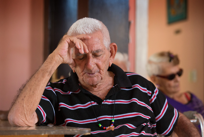 Anival Fuentes prays during afternoon devotionals at the Methodist Christian Home for retired pastors. Photo by Mike DuBose, UMNS.
