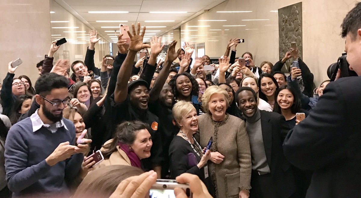 Hillary Clinton stops for photos with a group of well-wishers who had gathered outside a room off the lobby of the Interchurch Center in New York, where Clinton attended a Jan. 31 lunch. Photo by Danyelle Ditmer