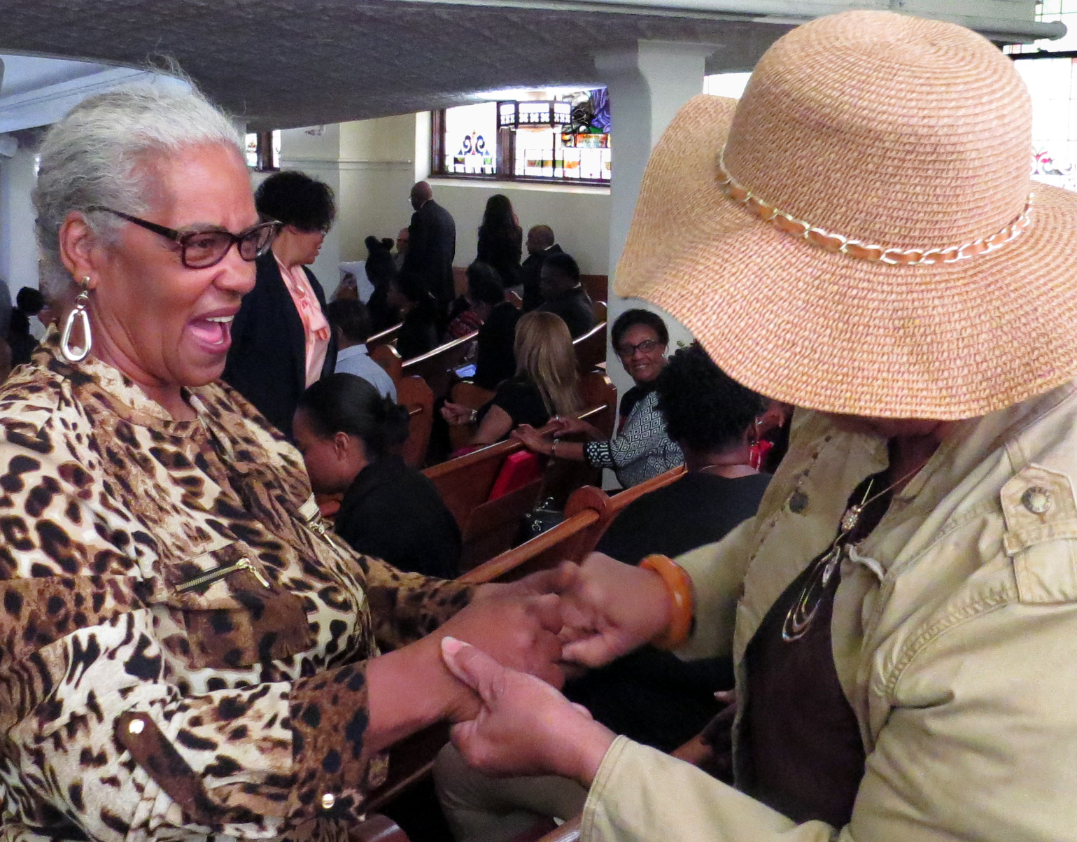 Shirley Williams greets a friend during a break in the Feb. 13, 2017 worship service at St. Paul United Methodist Church in Dallas. Photo by Sam Hodges, UMNS.