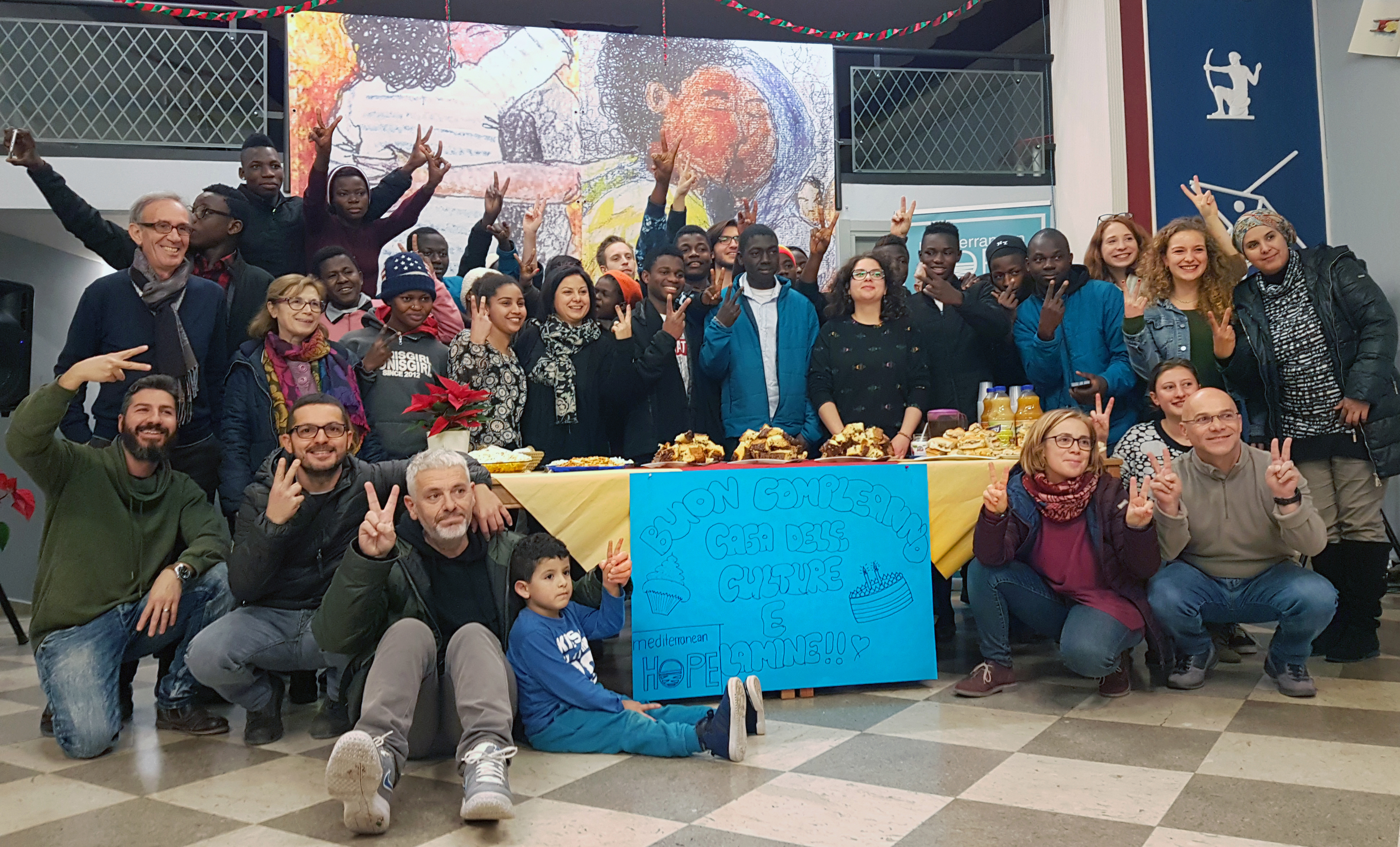A group of residents, volunteers and staff celebrate the birthday of a boy living in the Casa delle Culture in Scicli, Italy. The facility is a joint program of the local Methodist church and Mediterranean Hope, a project of the Federation of Protestant Churches in Italy. Photo courtesy of MH - Casa delle Culture.