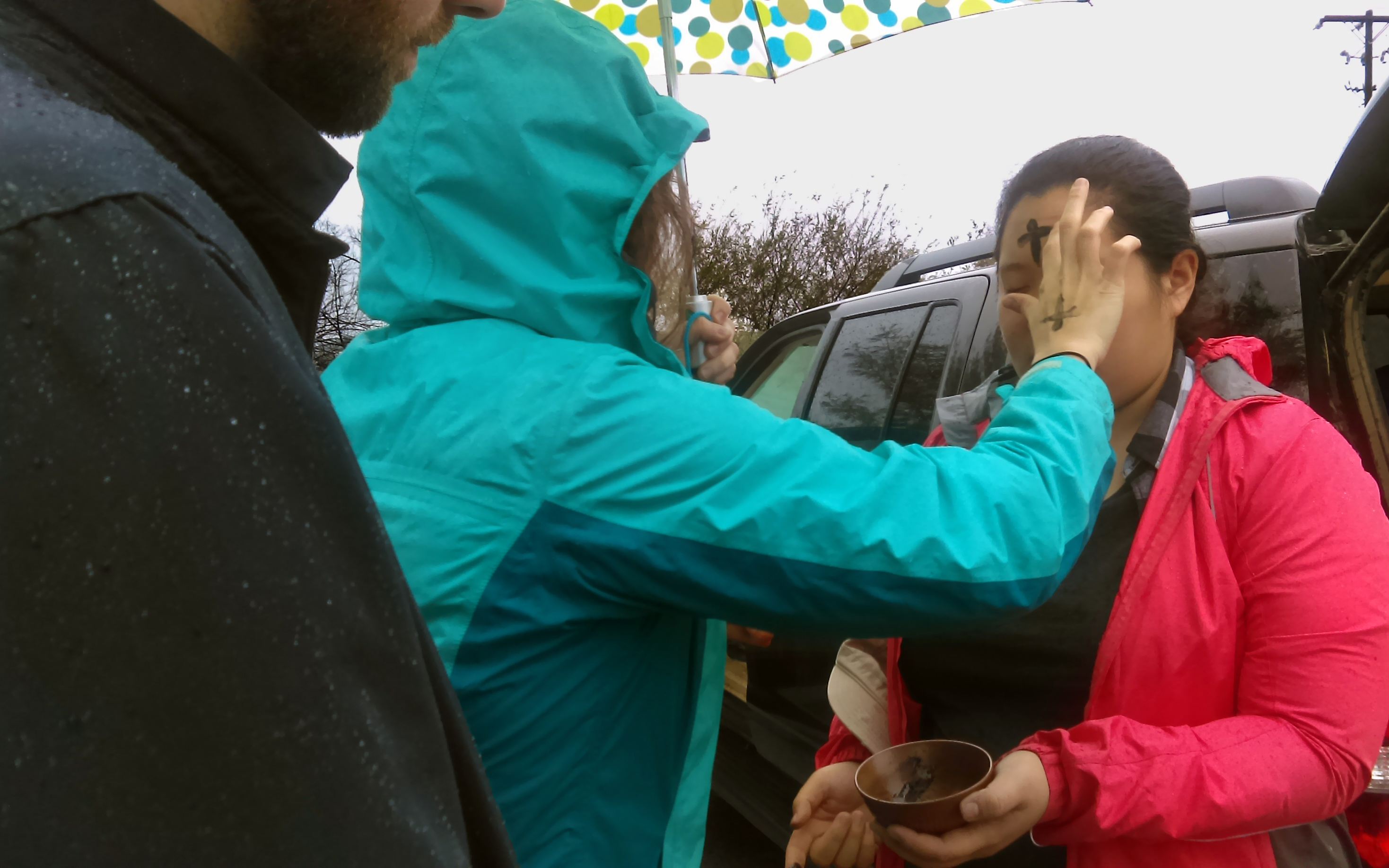 SueAnn Shiah, a member of City Church of East Nashville, receives ashes on her forehead during a prayer vigil in front of the Nashville Immigration and Customs Enforcement on Ash Wednesday, March 1, in Nashville, Tenn. The vigil was organized by the Nashville Community Defense. 