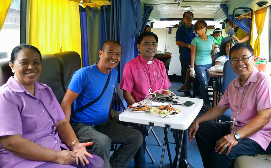 A new mobile bus clinic was donated to help United Methodists reach “more patients in far-flung areas,” said Bishop Rodolfo Juan, pictured third from left. The mobile bus clinic was donated by Riza Angara-Moises of the Genesis Transport Service, Inc., through Homer Garong, a United Methodist lawyer.  Photo courtesy of Bishop Rodolfo Juan.  