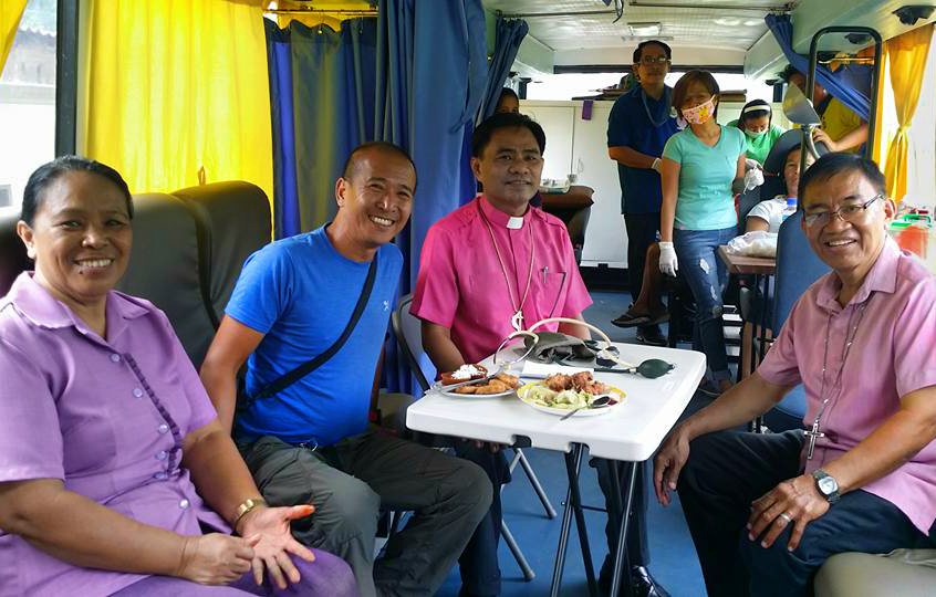 A new mobile bus clinic was donated to help United Methodists reach “more patients in far-flung areas,” said Bishop Rodolfo Juan, pictured third from left. The mobile bus clinic was donated by Riza Angara-Moises of the Genesis Transport Service, Inc., through Homer Garong, a United Methodist lawyer. Photo courtesy of Bishop Rodolfo Juan.