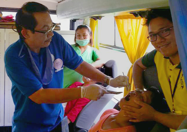 A patient receives medical treatment in the United Methodist mobile clinic. Photo courtesy of Bishop Rodolfo Juan.    