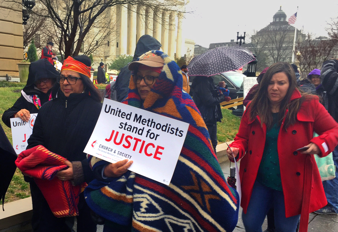 Doris Cooper, third from left, and Joyce Robins-Brown, second from left, joined thousands of other protesters, including United Methodists, who marched to oppose President Donald Trump’s executive order allowing construction on the Dakotas Access pipeline to resume. The Standing Rock Sioux Tribe, based in North Dakota, organized the Native Nations March.  Photo by Erik Alsgaard, UMNS.