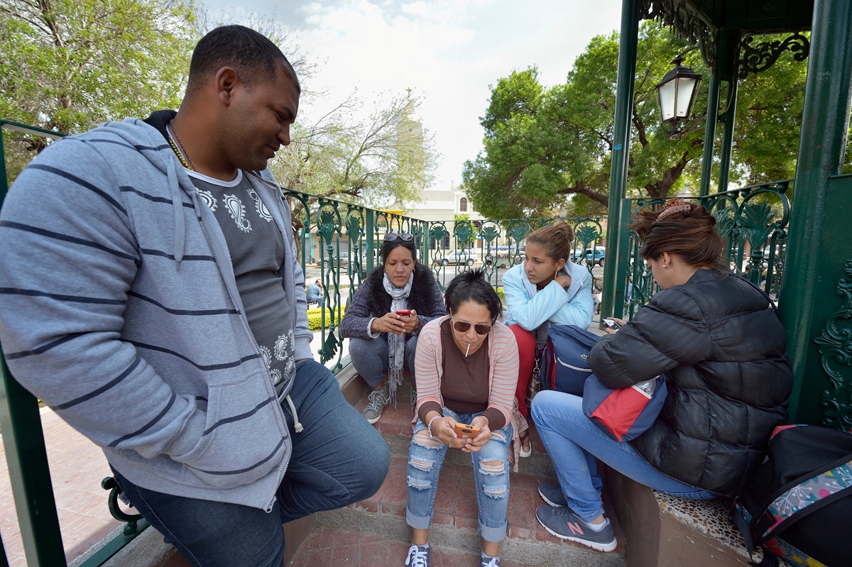 Cuban immigrants wait in a park in Nuevo Laredo, Mexico. Hundreds of Cubans are stuck in the border city, caught in limbo by the elimination in January of the infamous “wet foot, dry foot” policy of the United States. They are not allowed to enter the U.S. yet most don't want to return to Cuba. Photo by Paul Jeffrey.