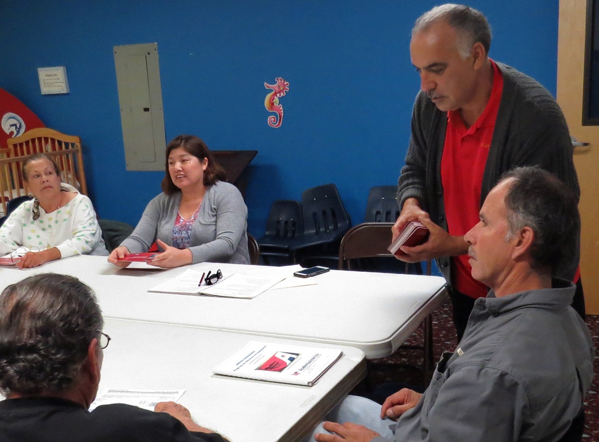 Carlos Gonzalez (standing) of the nonprofit Academia América leads a U.S. citizenship class at La Trinidad United Methodist Church in San Antonio. The class members have legal status, but some say they’re worried anyway given President Trump’s more aggressive approach on immigration policy. Photo by Sam Hodges, UMNS.