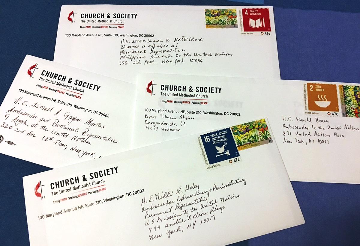 During a March 24 meeting at the Church Center for the U.N., directors of the United Methodist Board of Church and Society wrote letters to their ambassadors, urging support for the U.N.'s Sustainable Development Goals. Ambassadors receiving letters included representatives of the U.S., Angola, the Philippines and Germany to the UN. Photo by Levi Bautista, GBCS
