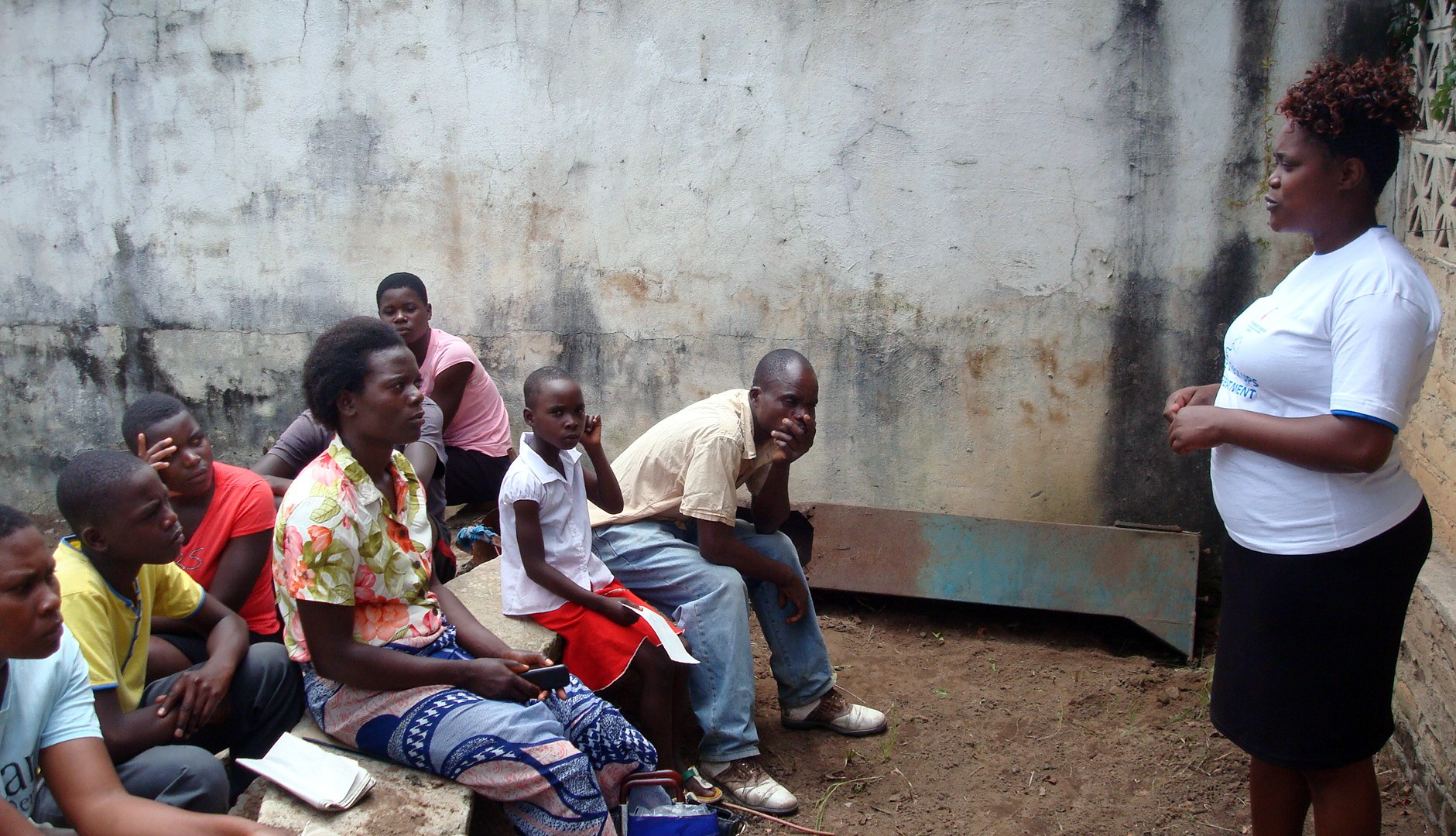 A woman speaks to attendees of a free medical outreach program in Zimbabwe conducted by The United Methodist Church. The program, which targeted people from disadvantaged communities who needed routine treatment, saw hundreds being treated while 87 underwent voluntary counseling and testing for HIV/AIDS. Photo by Kudzai Chingwe, UMNS.