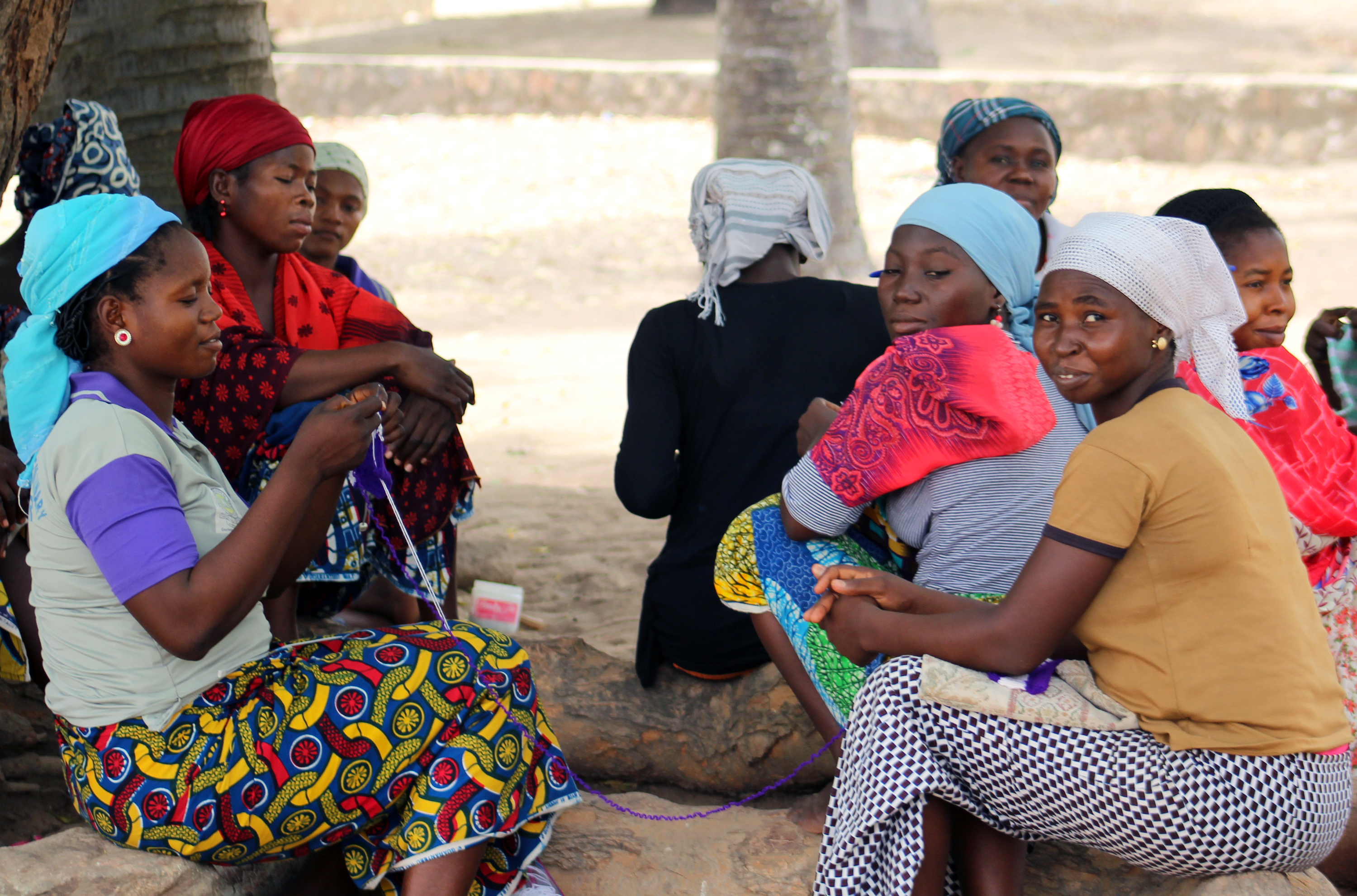 Women take a break from their knitting class at Banyam Theological Seminary in Bambur, Nigeria. The seminary is now providing training in basic skills for the wives of male students such as tailoring, knitting and basic administrative skills that will help them run a church alongside their husband. Photo by Julu Swen, UMNS