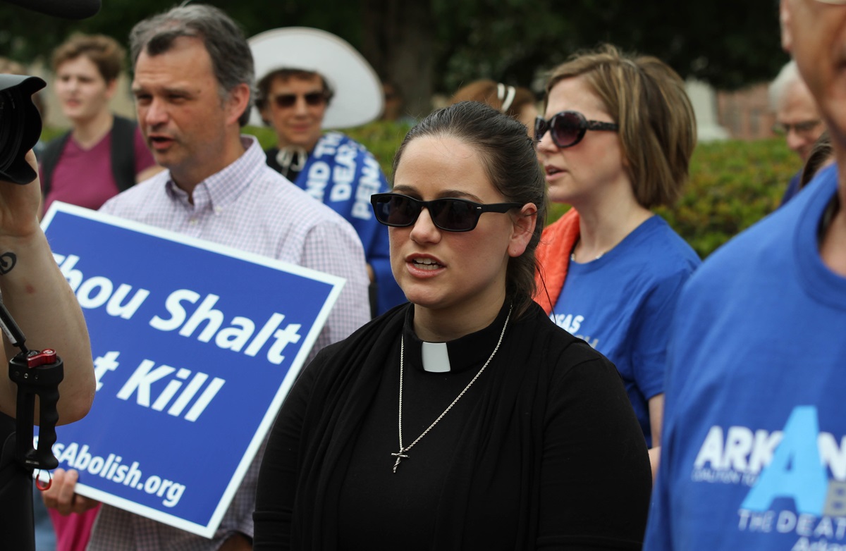 The Rev. Kathleen McMurray joins a Good Friday vigil at the Arkansas Capitol in Little Rock to protest planned executions of seven inmates. McMurray is associate pastor of Grace United Methodist Church in Conway, Ark. Photo by Amy Forbus, Arkansas United Methodist

