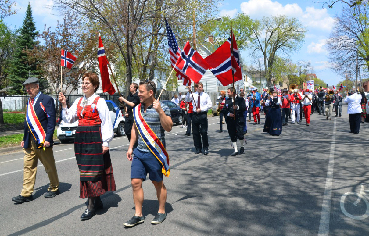The Rev. Kristin Sundt, front, in traditional Norweigan clothing, leads members of the congregation from Norwegian Lutheran Memorial Church in Minneapolis, Minnesota, known as Mindekirken, in a parade celebrating Norwegian Constitution Day. The church marks the day each year on the weekend closest to May 17. Photo courtesy of Kristin Sundt. 