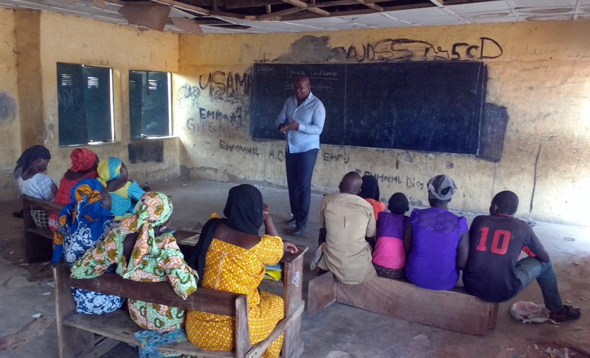 The head teacher of McBride Literacy School in Jalingo, Nigeria, ThankGod Heman, teaches a Hausa language class for beginners; the other main class is a three-year advanced English course. The goal of the school, which is operated through the church, is to improve the education level of people who can neither read nor write so they can speak, write, read and understand the Bible. Photo by Sharon Adamu Bambuka, UMNS.