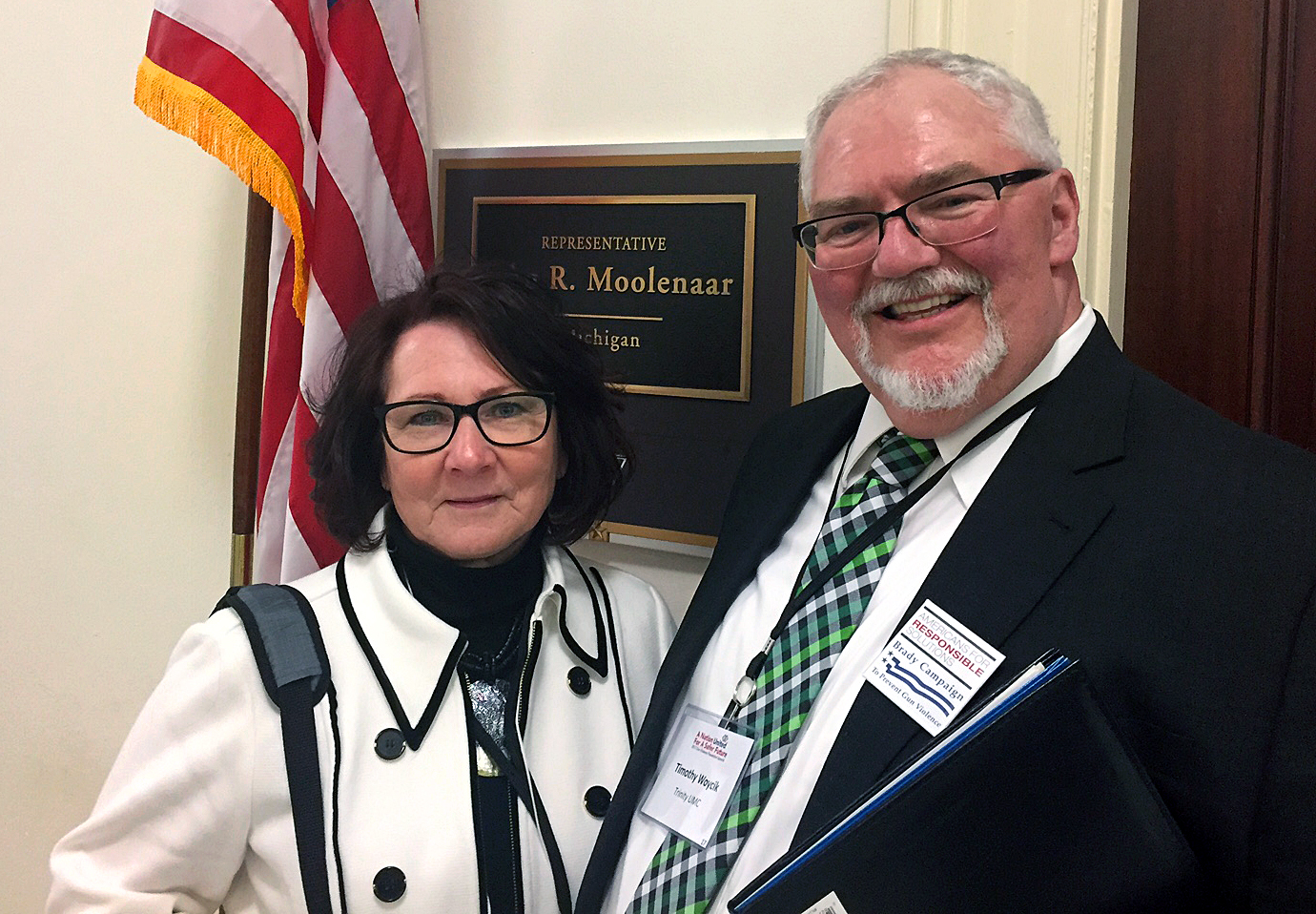 Chris Schwind, left, and her husband, the Rev. Tim Woycik, stand outside the office of Republican Rep. John Moolenaar of Michigan. The United Methodist couple drove 600 miles to Washington, D.C., to share the story of their daughter’s murder as part of a summit on gun violence sponsored by the Brady Campaign to End Gun Violence and Americans for Responsible Solutions. Photo by Erik Alsgaard, UMNS.