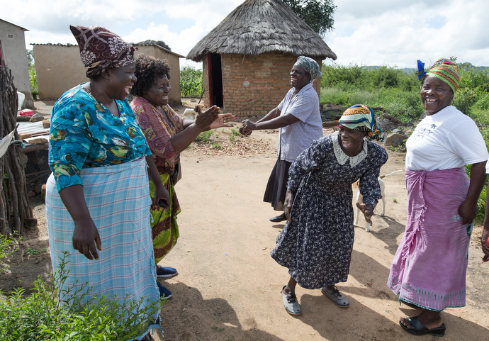 Margaret Tagwira (second from left) has a joyful reunion with women who are growing the chaya plant in Chivi, Zimbabwe. From left are: Sarudzai Mkachana, Tagwira, Regina Mavuko, Sylivia Shuro Kamurai and Modesta Manzungo. Photo by Mike DuBose, UMNS.